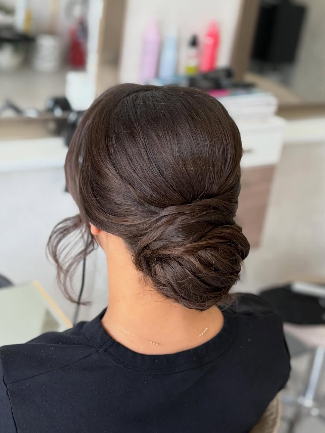 Elegant Low Chignon With Wispy Face-Framing Strands