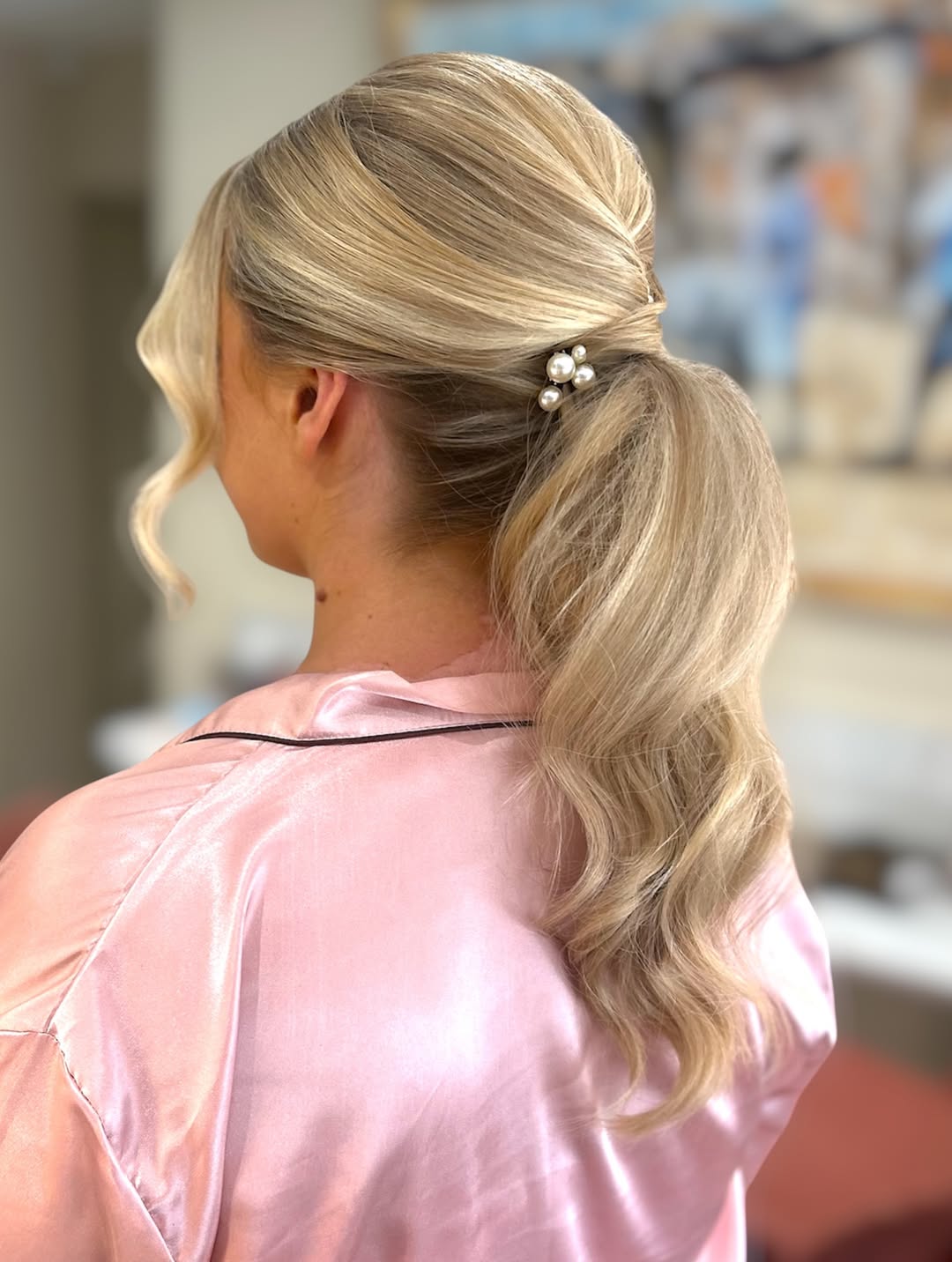 Elegant Low Ponytail With Loose Waves & Pearl Accent
