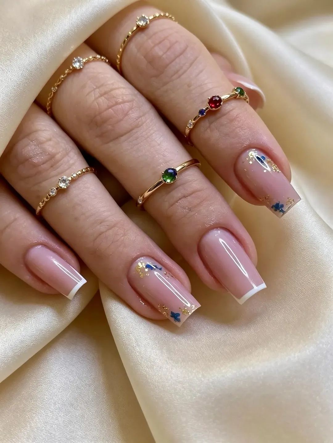 Elegant Pink French Tips With Gold And Blue Accents