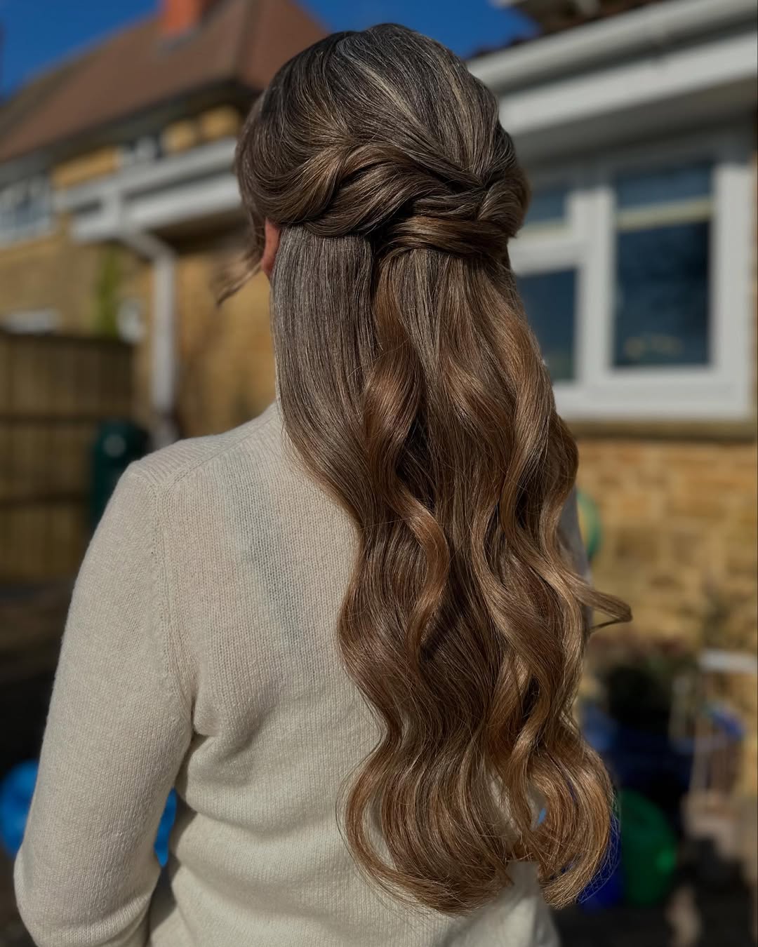 Elegant Twisted Half-Up With Loose Waves