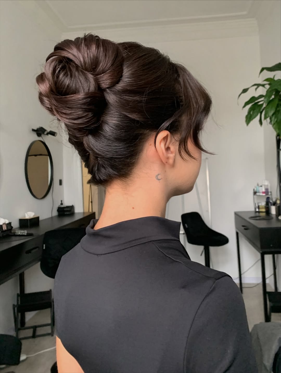 Elegant Twisted Low Updo With Face Framing Tendrils