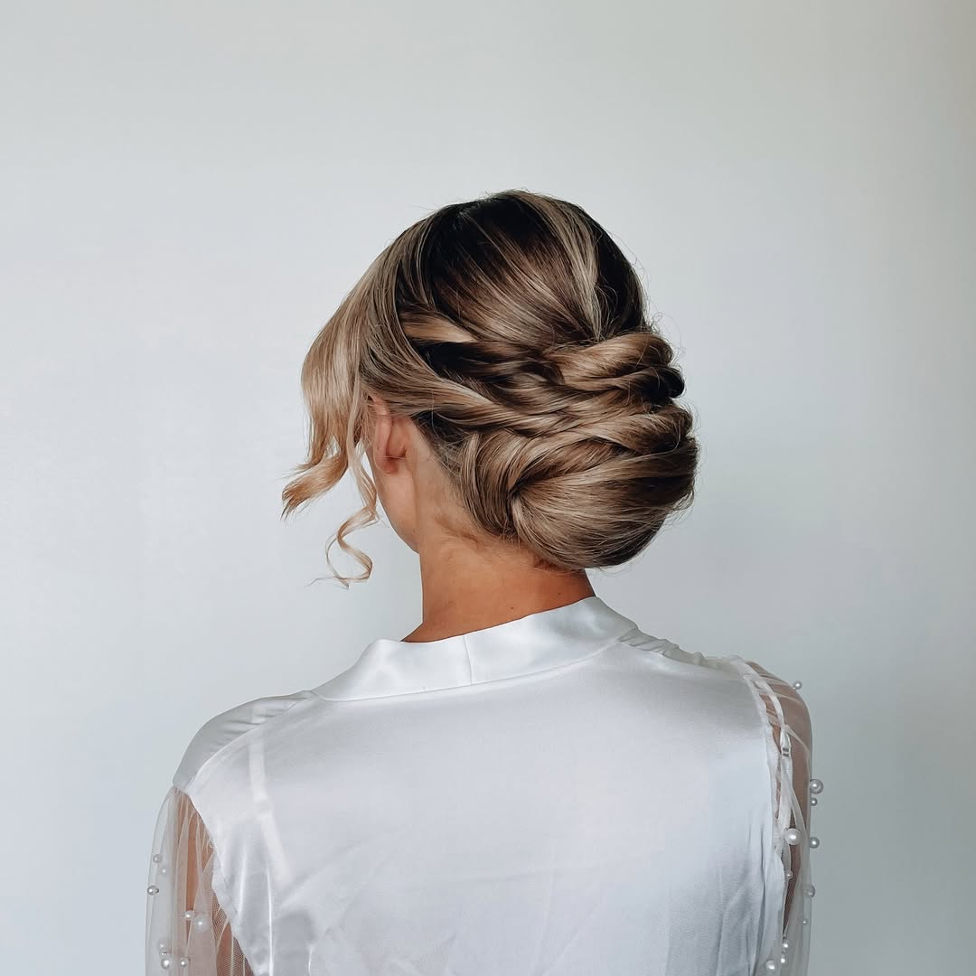 Elegant Twisted Updo with Loose Face-Framing Curls