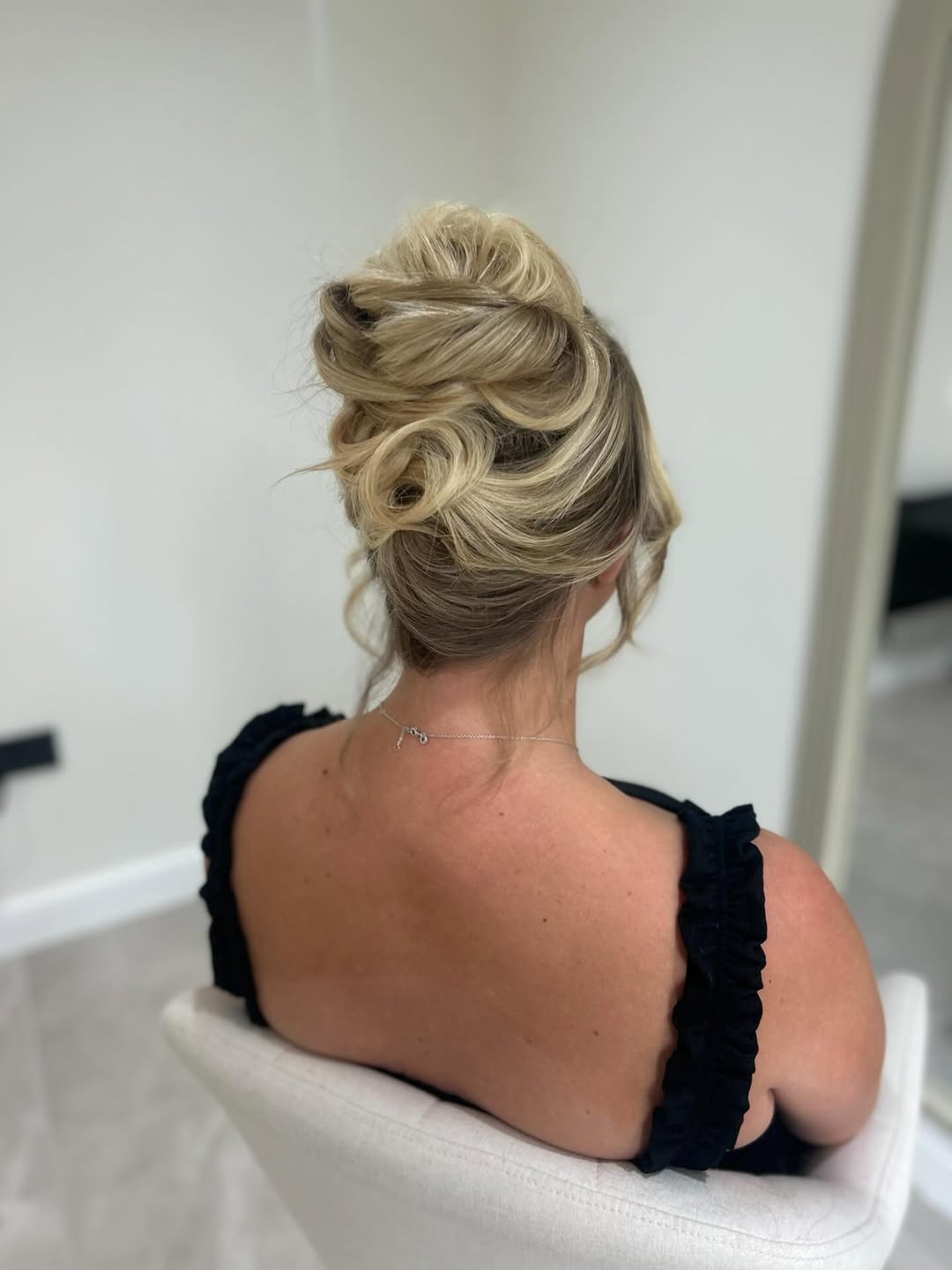 Elegant Voluminous Updo With Loose Curls
