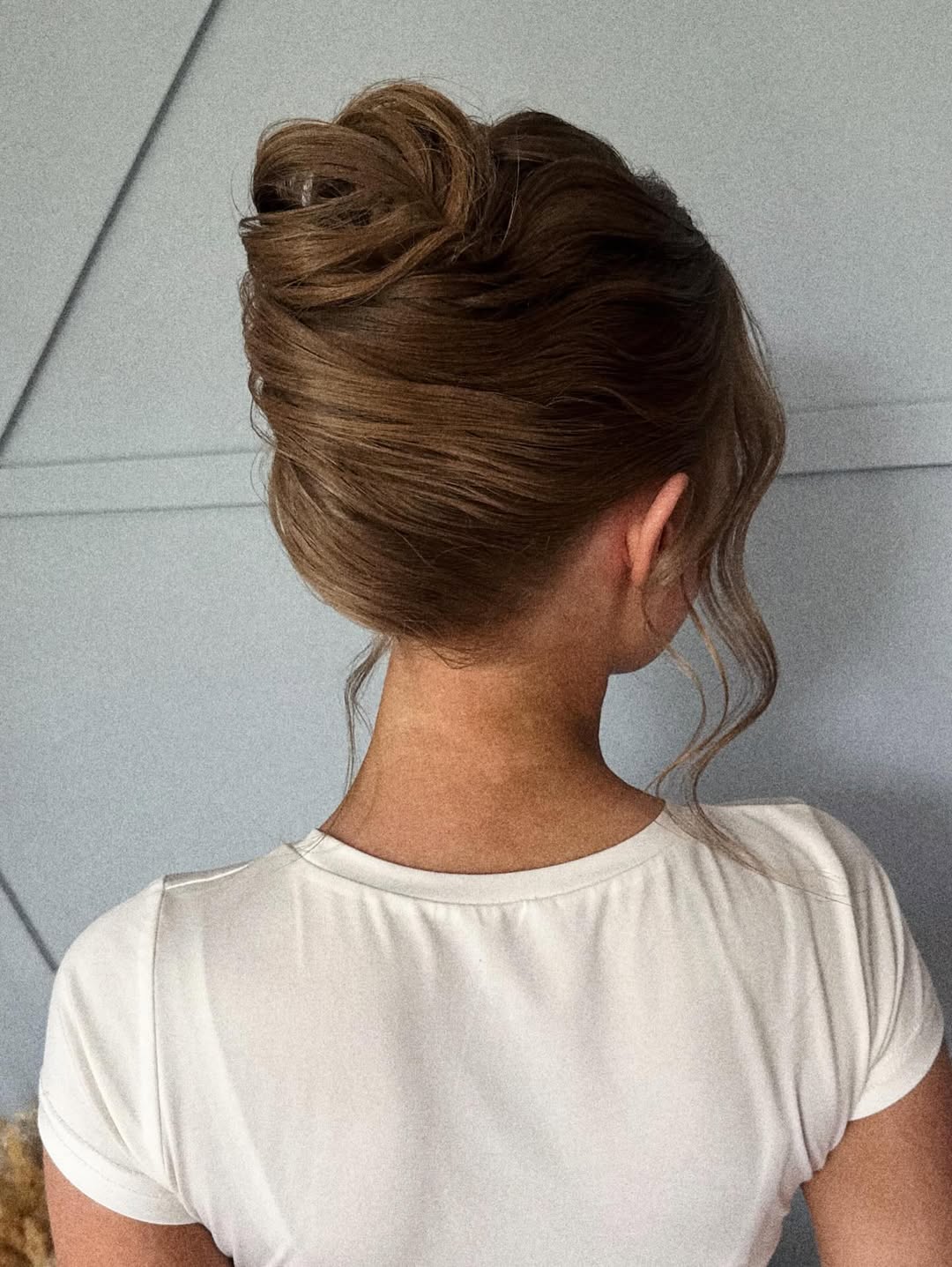 Elegant Wavy Updo With Face-Framing Tendrils