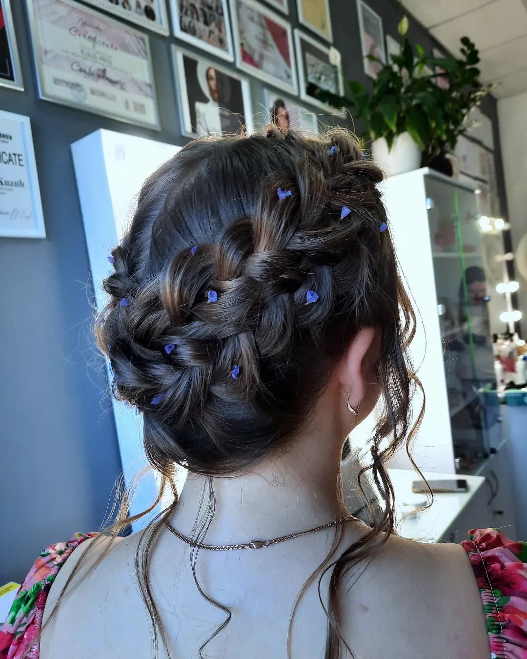 Elegant Woven Updo With Delicate Floral Accents