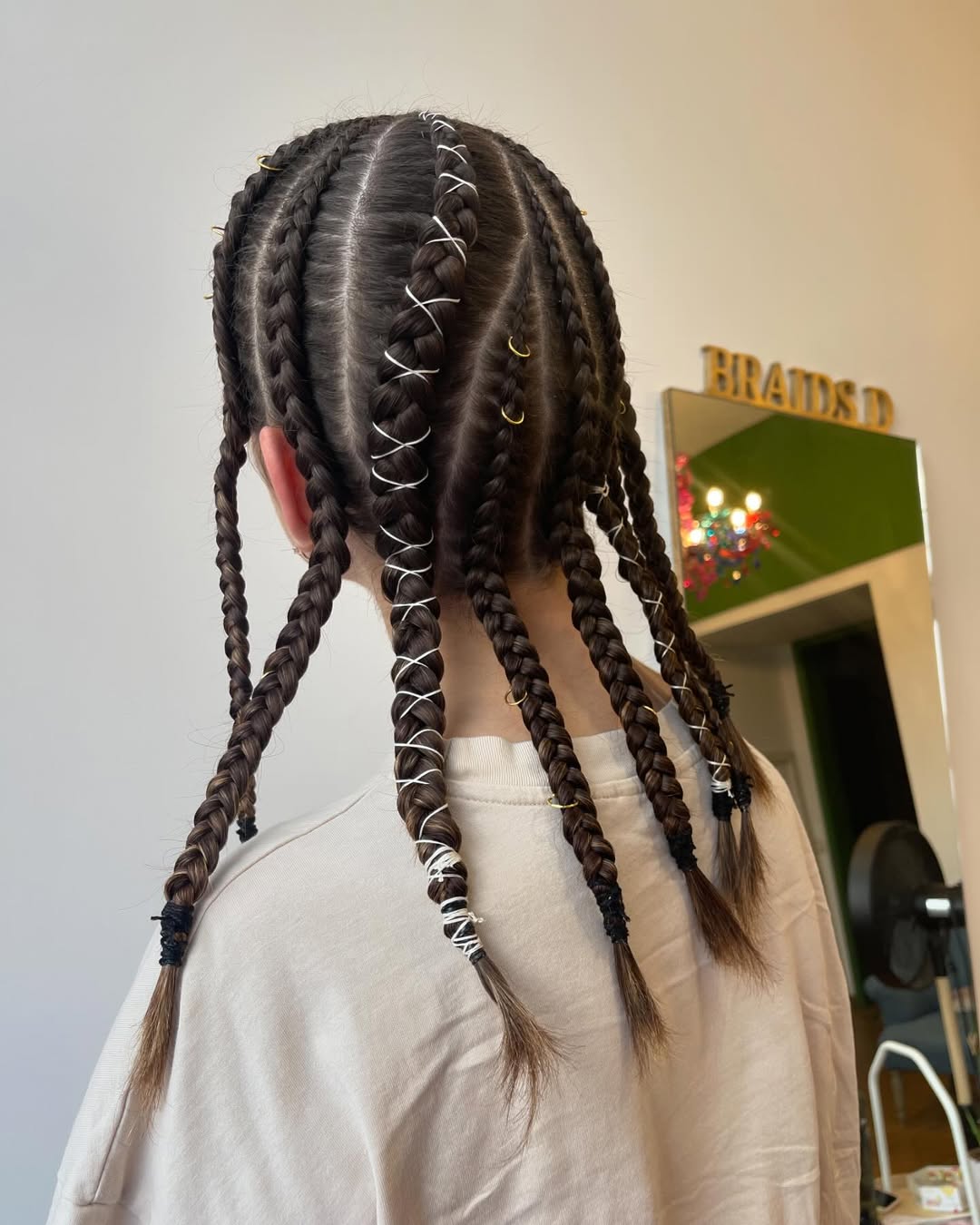 Festival Braids With White Wrap And Gold Rings