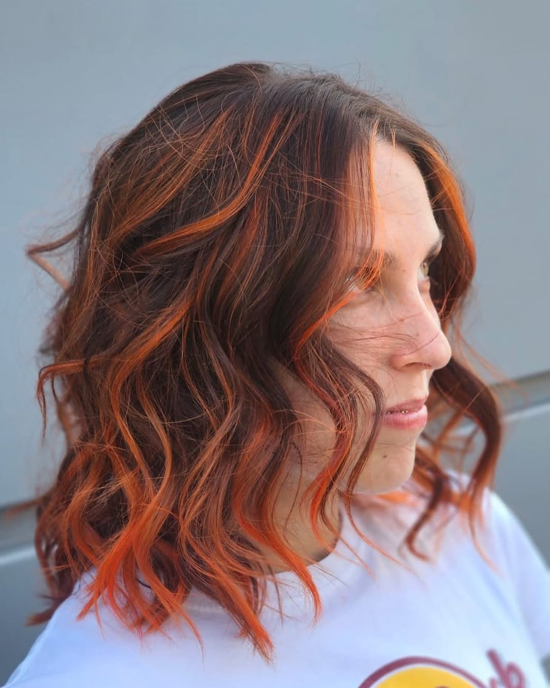 Fiery Orange Streaks On Wavy Chocolate Lob
