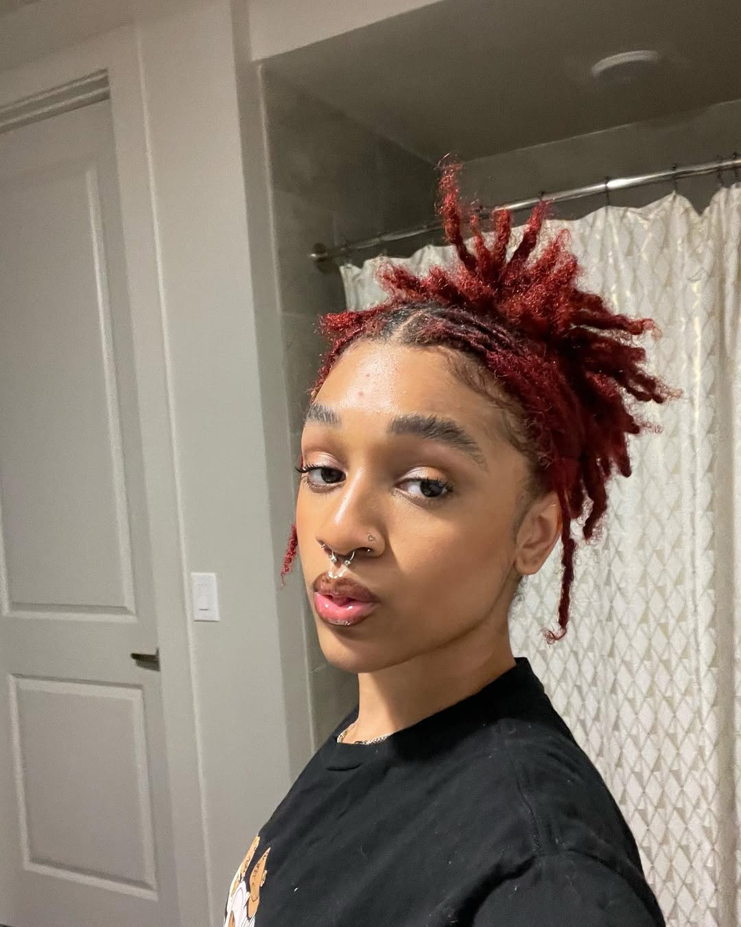 Fiery Red Short Locs Updo With Exposed Roots