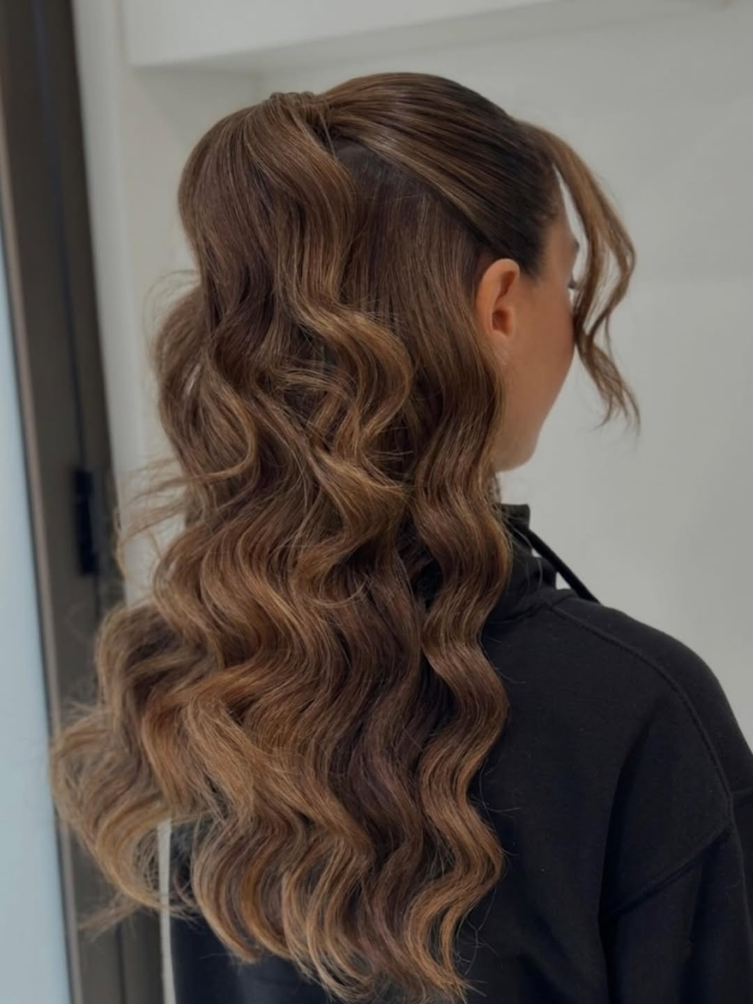 Glamorous Half Up Waves With Face-Framing Tendrils