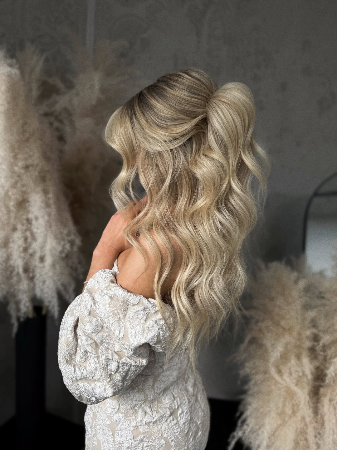 Glamorous Half Updo With Voluminous Waves