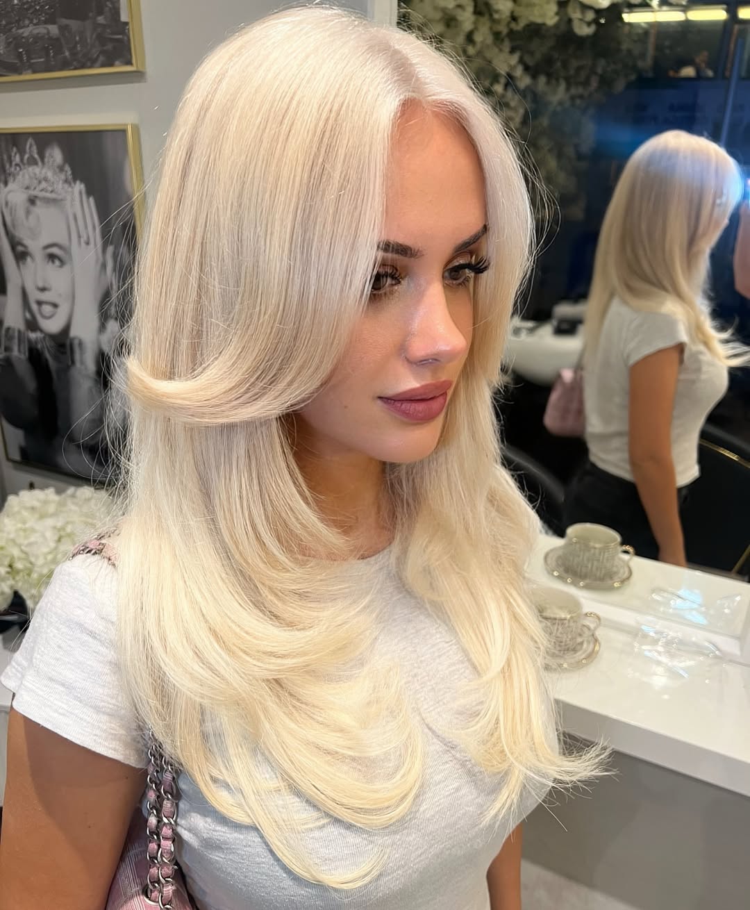 Glamorous Platinum Blonde Layers and Curtain Bangs