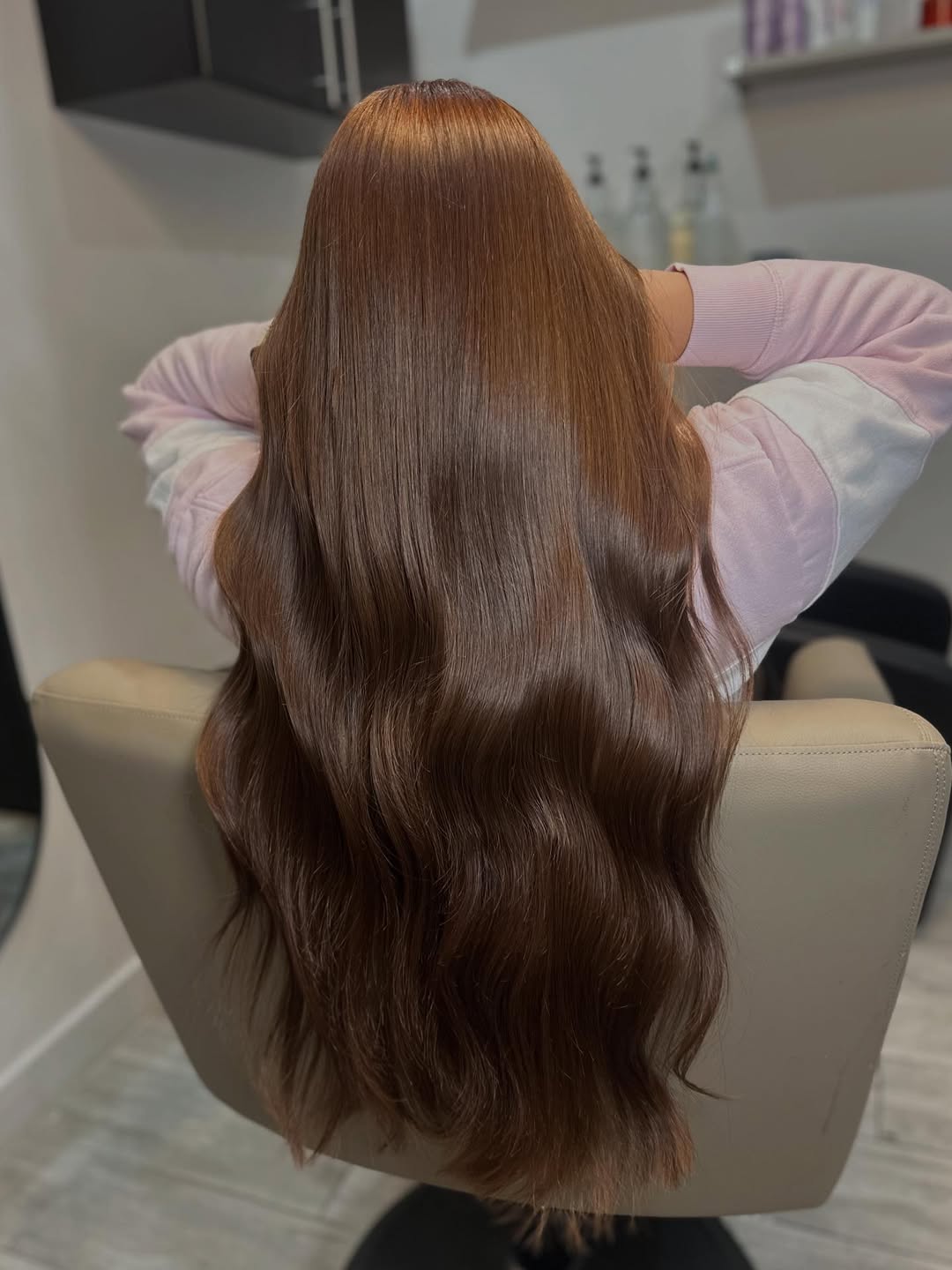 Glossy Chestnut Waves With Subtle Red Undertones