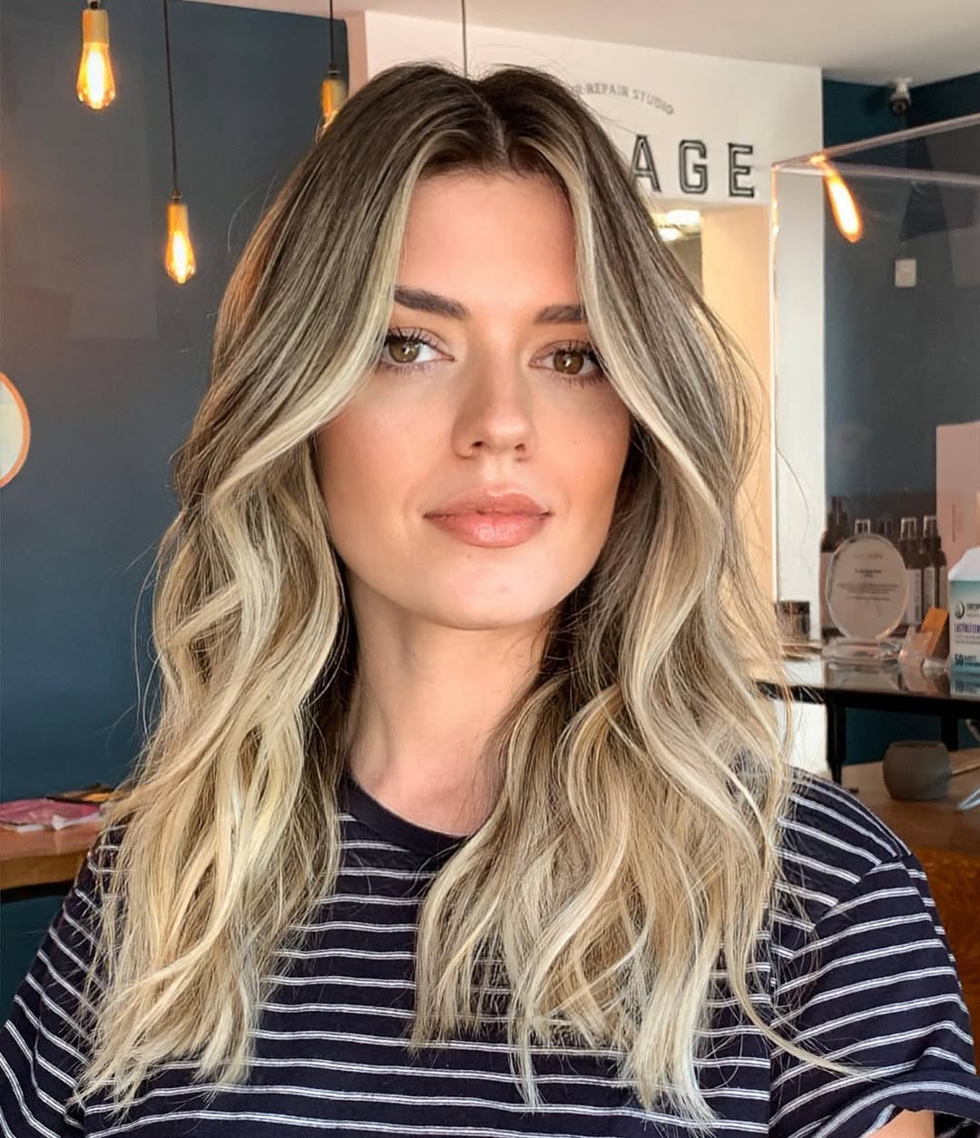 Golden Blonde Waves With Face-Framing Highlights And Shadow Root