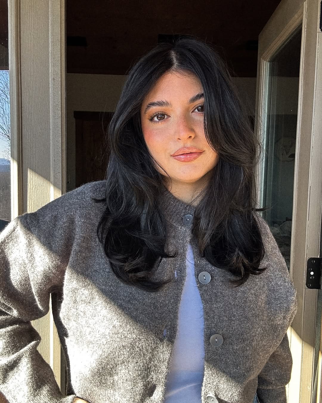 Gorgeous Dark Wavy Layers With Face-Framing Bangs