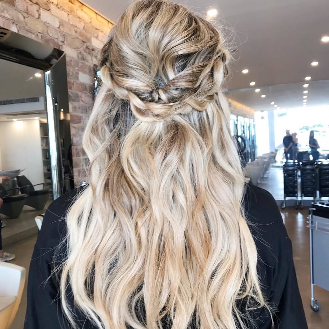 Half-Up Braided Crown With Wavy Blonde Hair