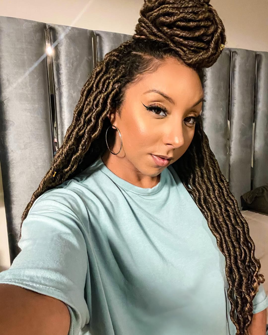 Half Up Bun Faux Locs With Golden Accents