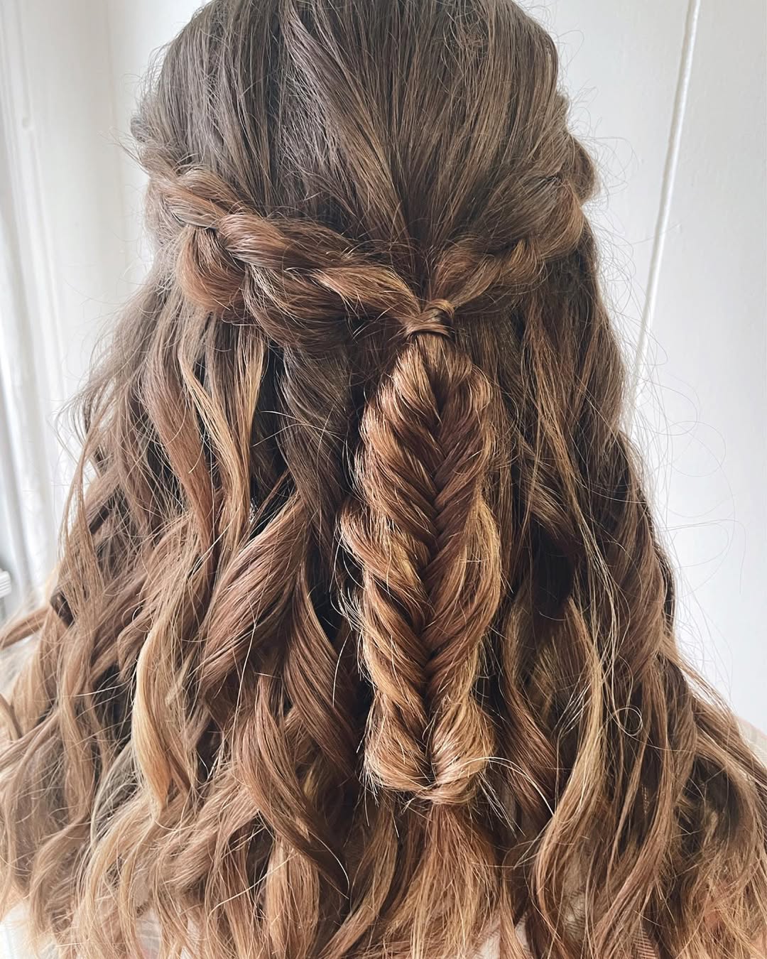 Half-Up Fishtail Braid With Wavy Brunette Hair