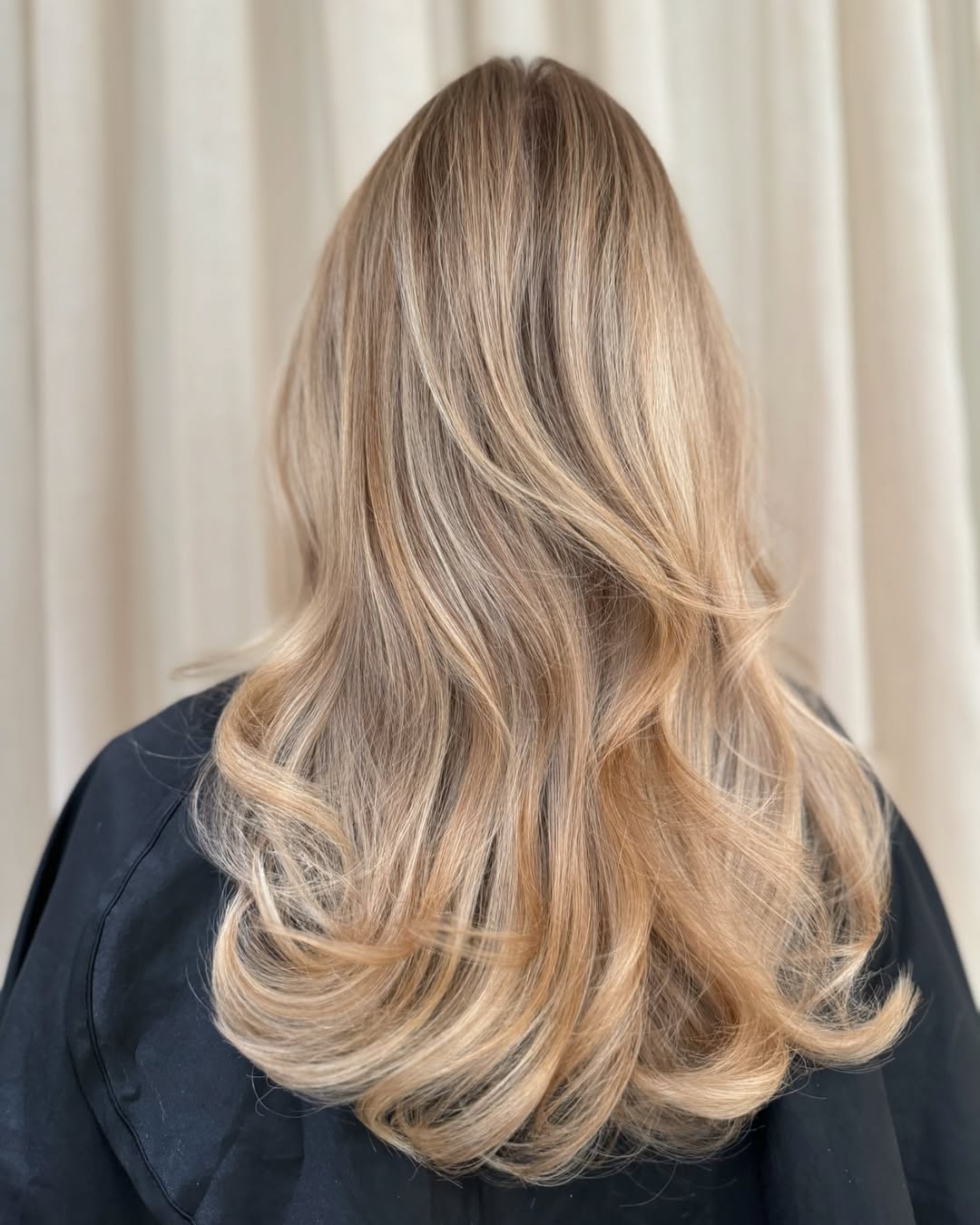 Honey Blonde Curls With Shadow Root Mid-Length