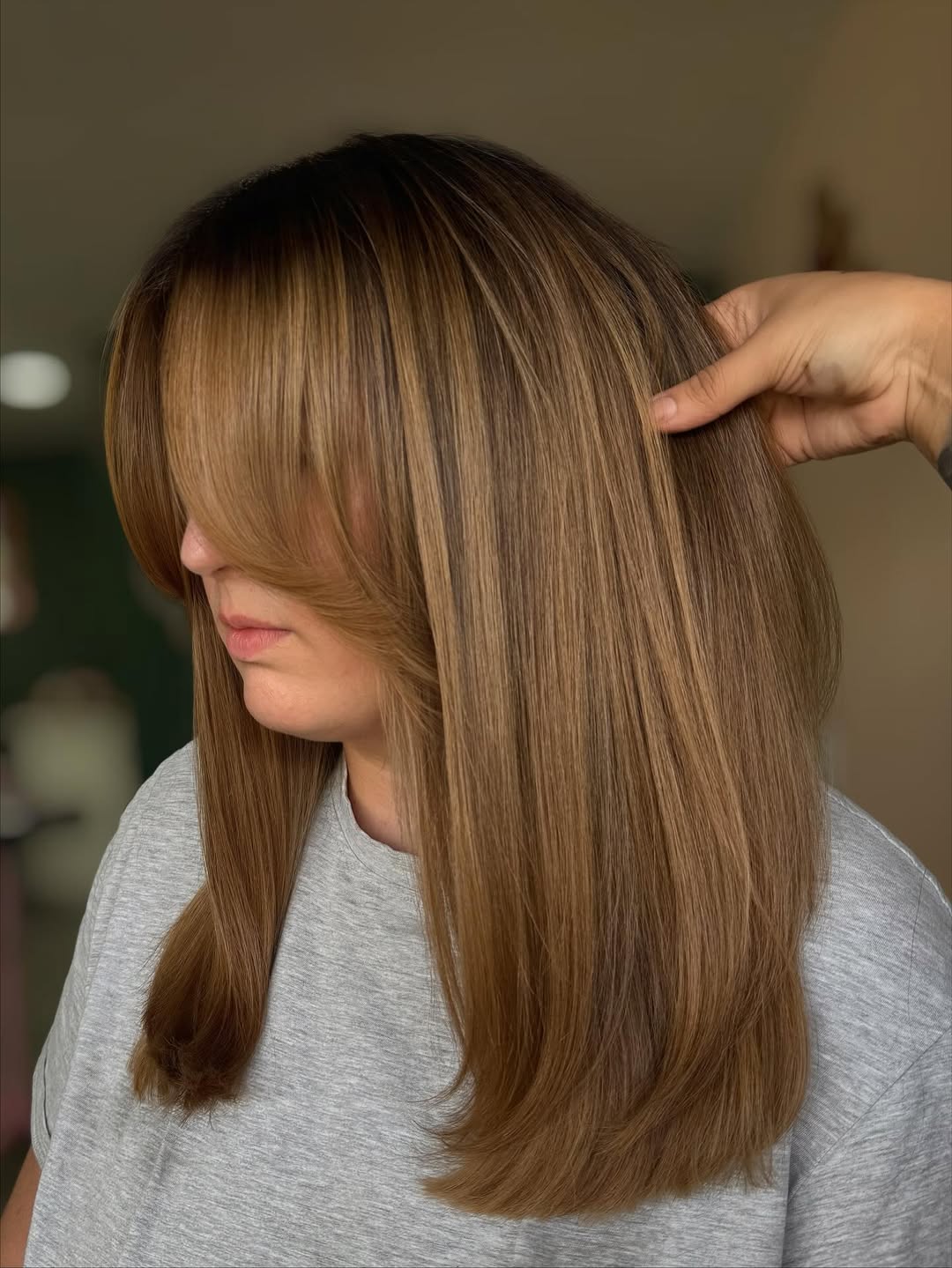 Honey Brown Layers With Wispy Face-Framing Bangs