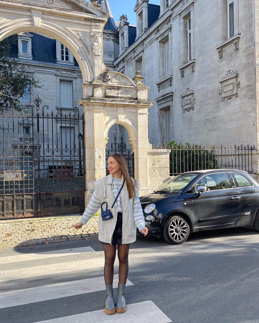 Lightweight Vest Over Striped Sweater and Mini Skirt