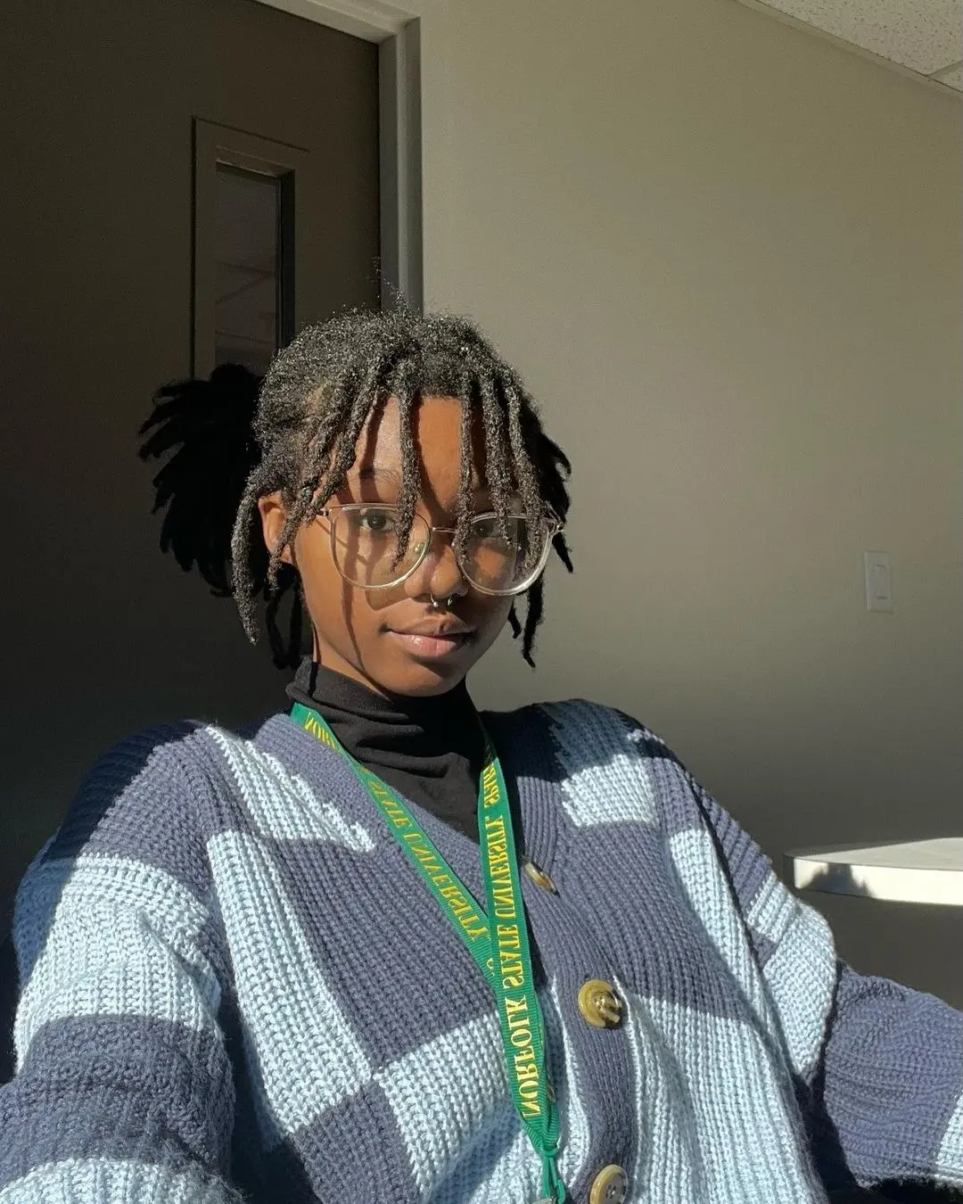 Locs With Face-Framing Fringe And Half-Up Style