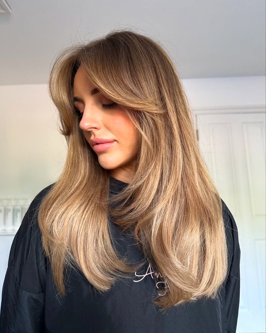 Long Dirty Blonde Layers With Volume Bangs