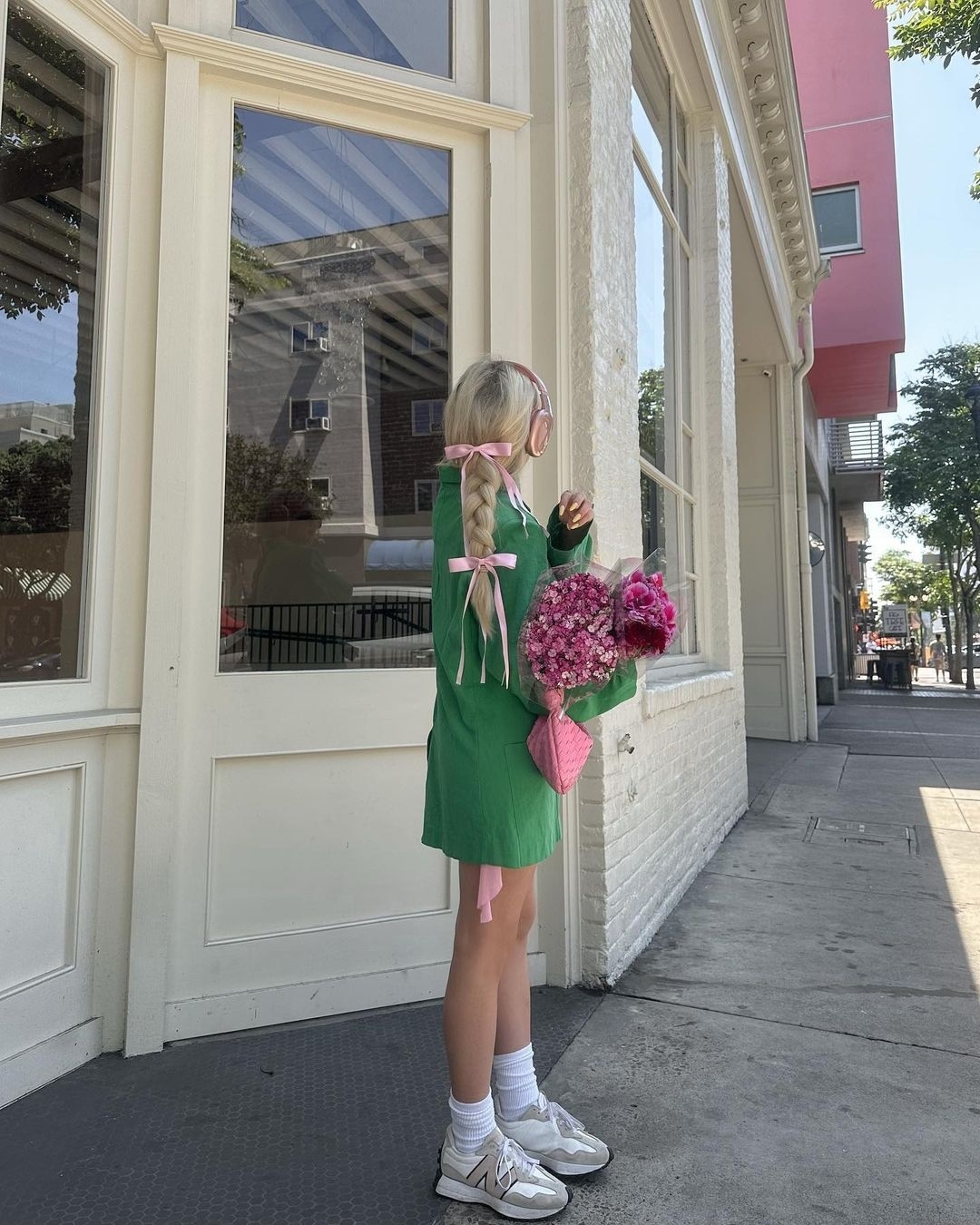 Long Platinum Blonde Braid With Pink Ribbons