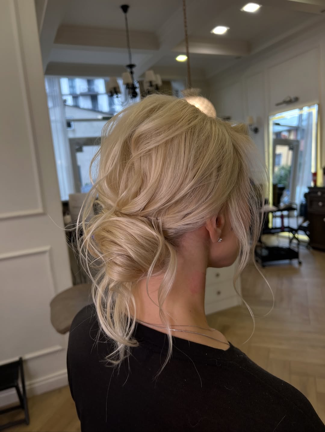 Messy Low Updo With Face-Framing Tendrils
