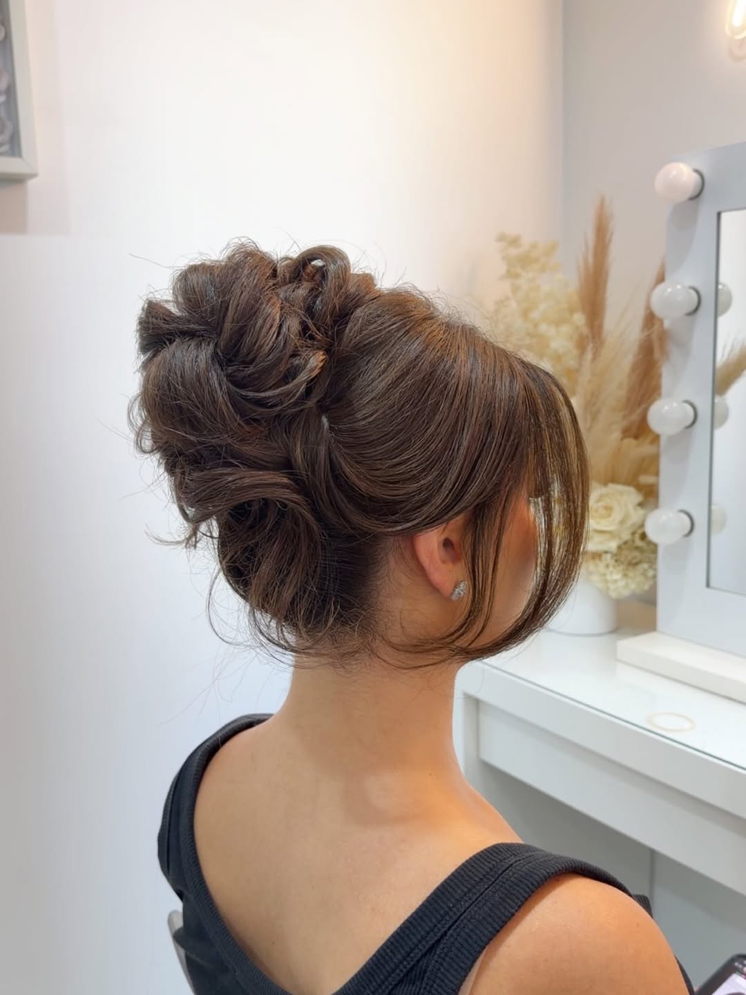 Messy Updo With Face-Framing Layers