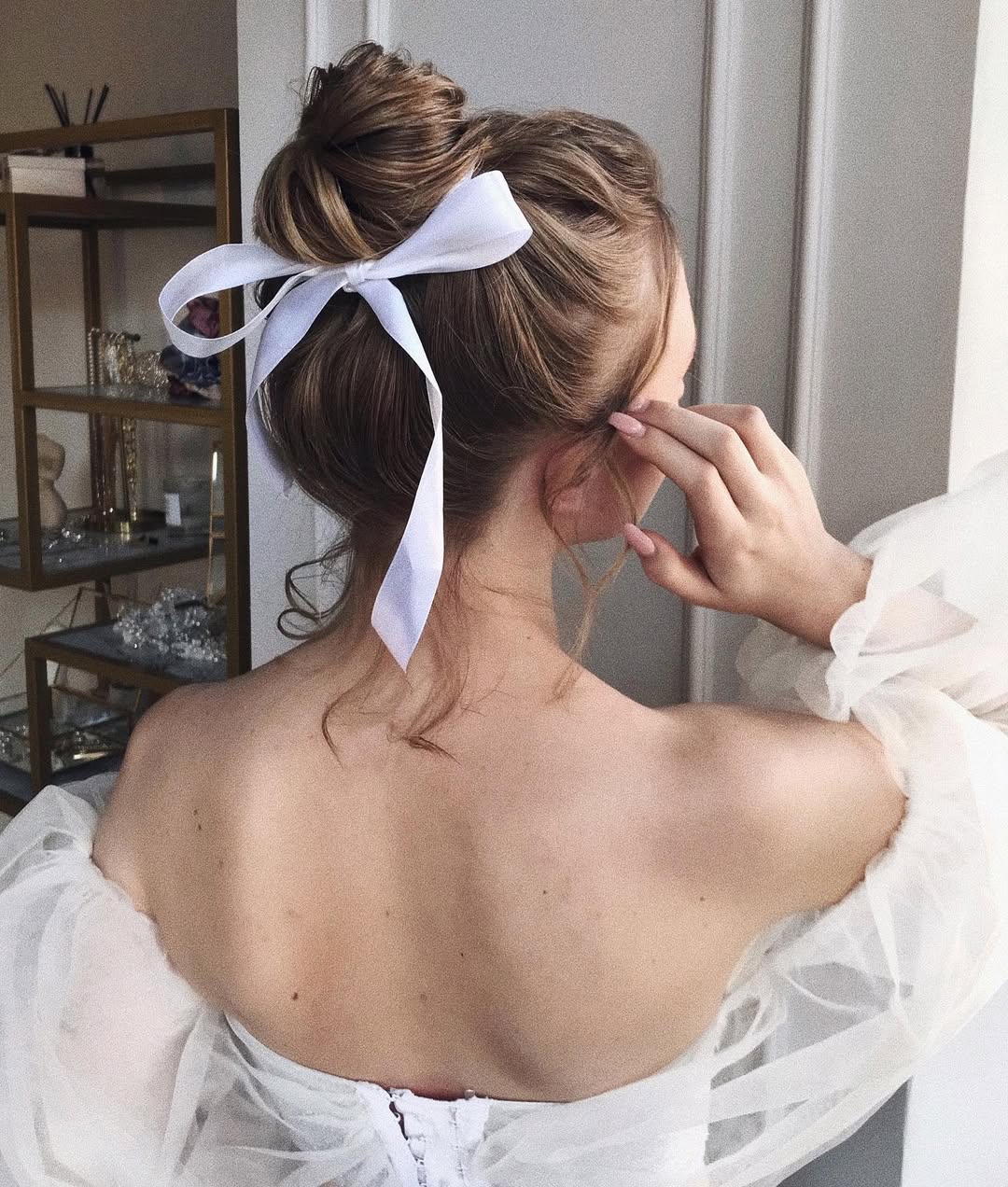 Messy Updo With White Ribbon Bow