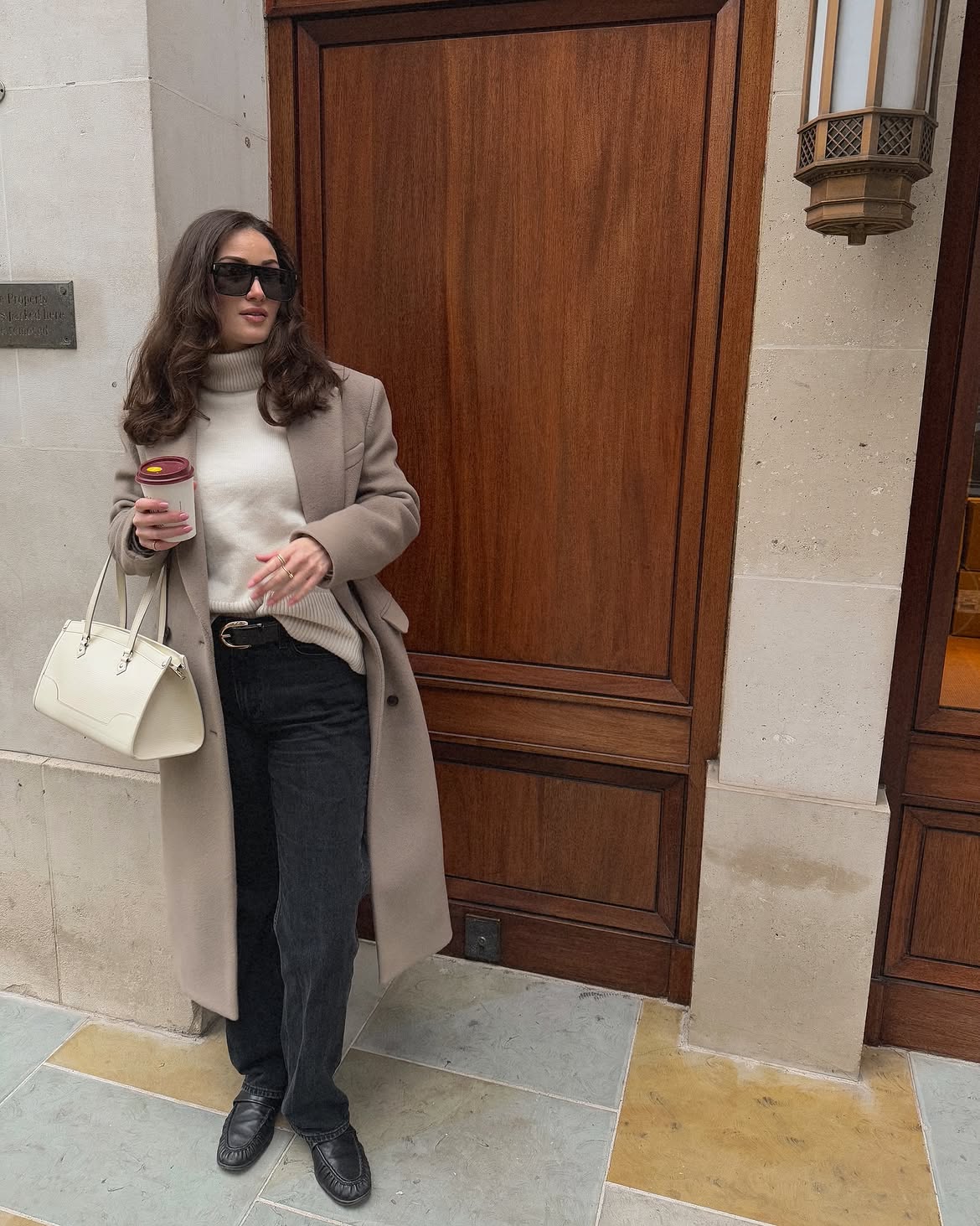 Neutral Knit Tucked Into Dark Wash Jeans With Classic Camel Coat