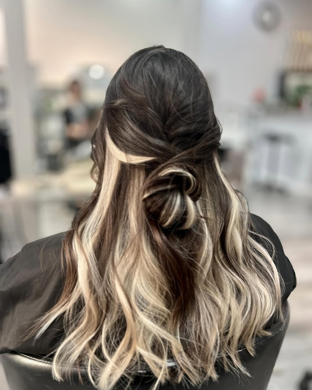 Peekaboo Blonde Strands Half Up Braided Bun