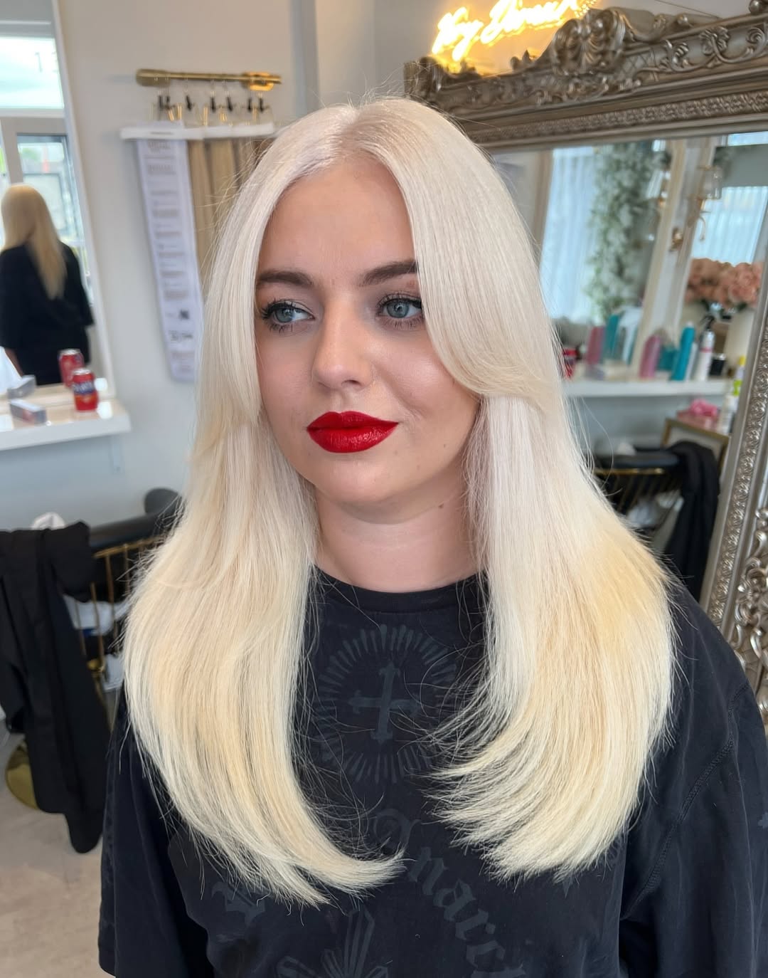 Platinum Blonde Layers With Face-Framing Bangs