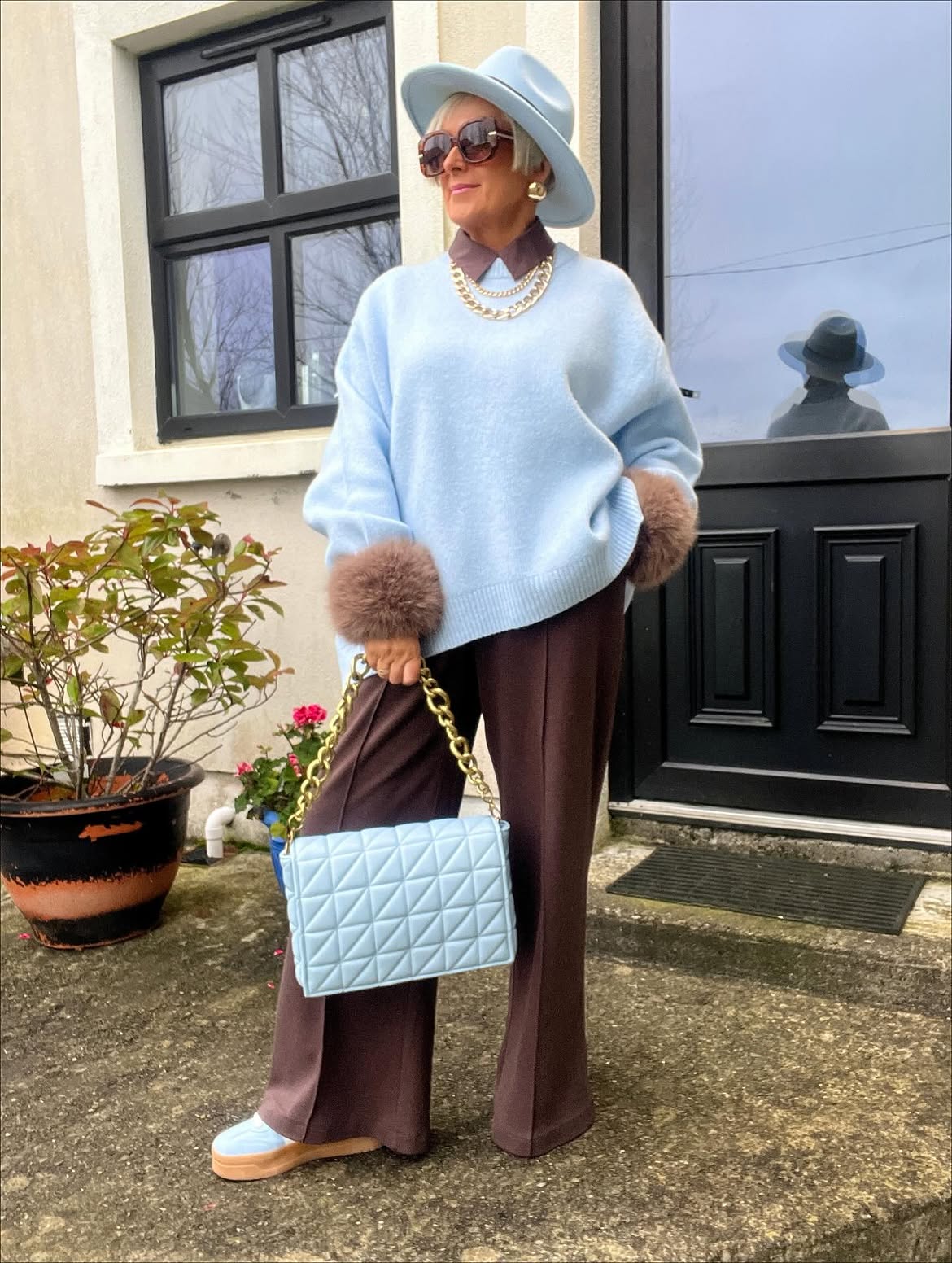 Powder Blue Sweater With Chocolate Trousers And Light Blue Bag