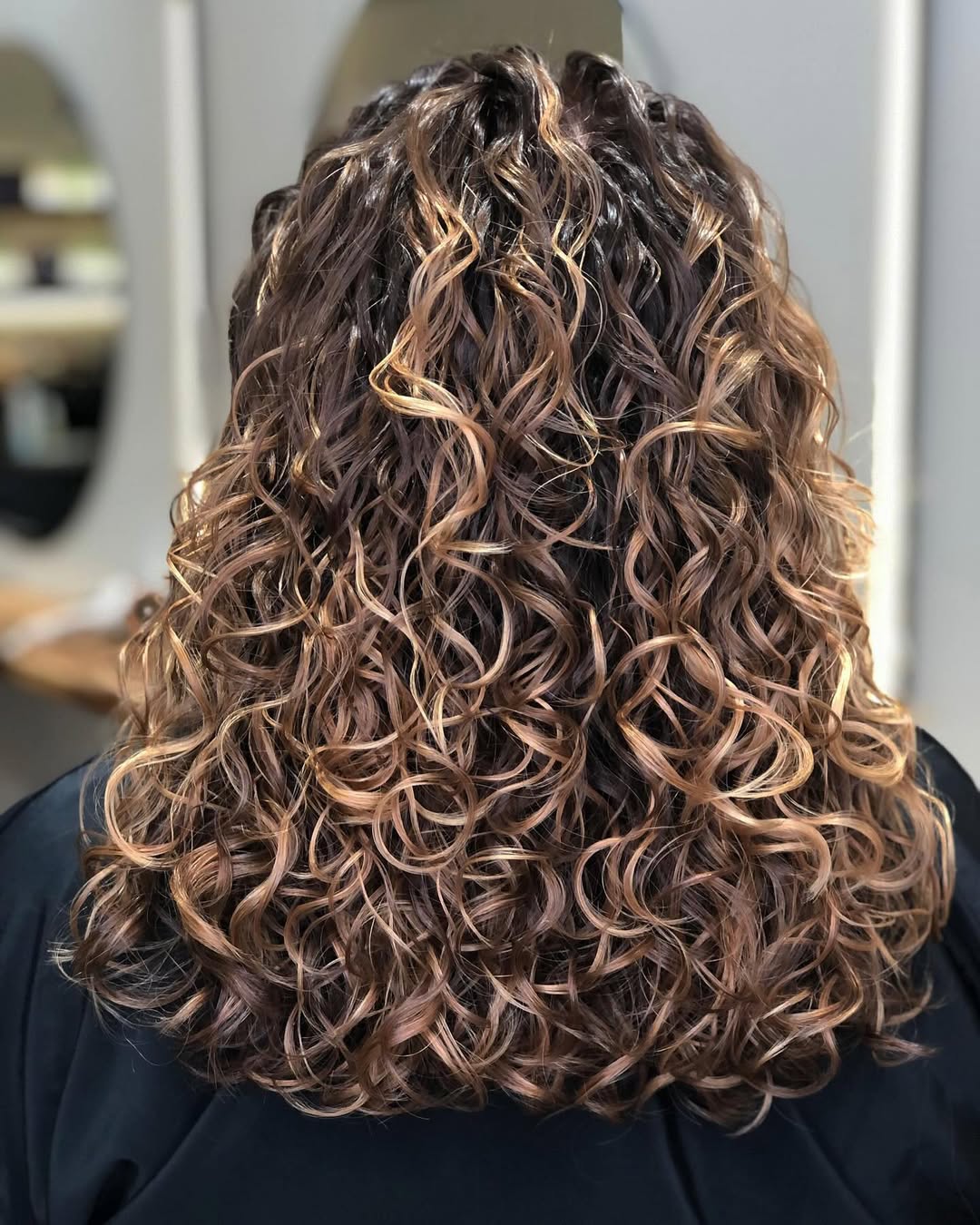 Radiant Caramel Swirl Highlights On Lush Curls
