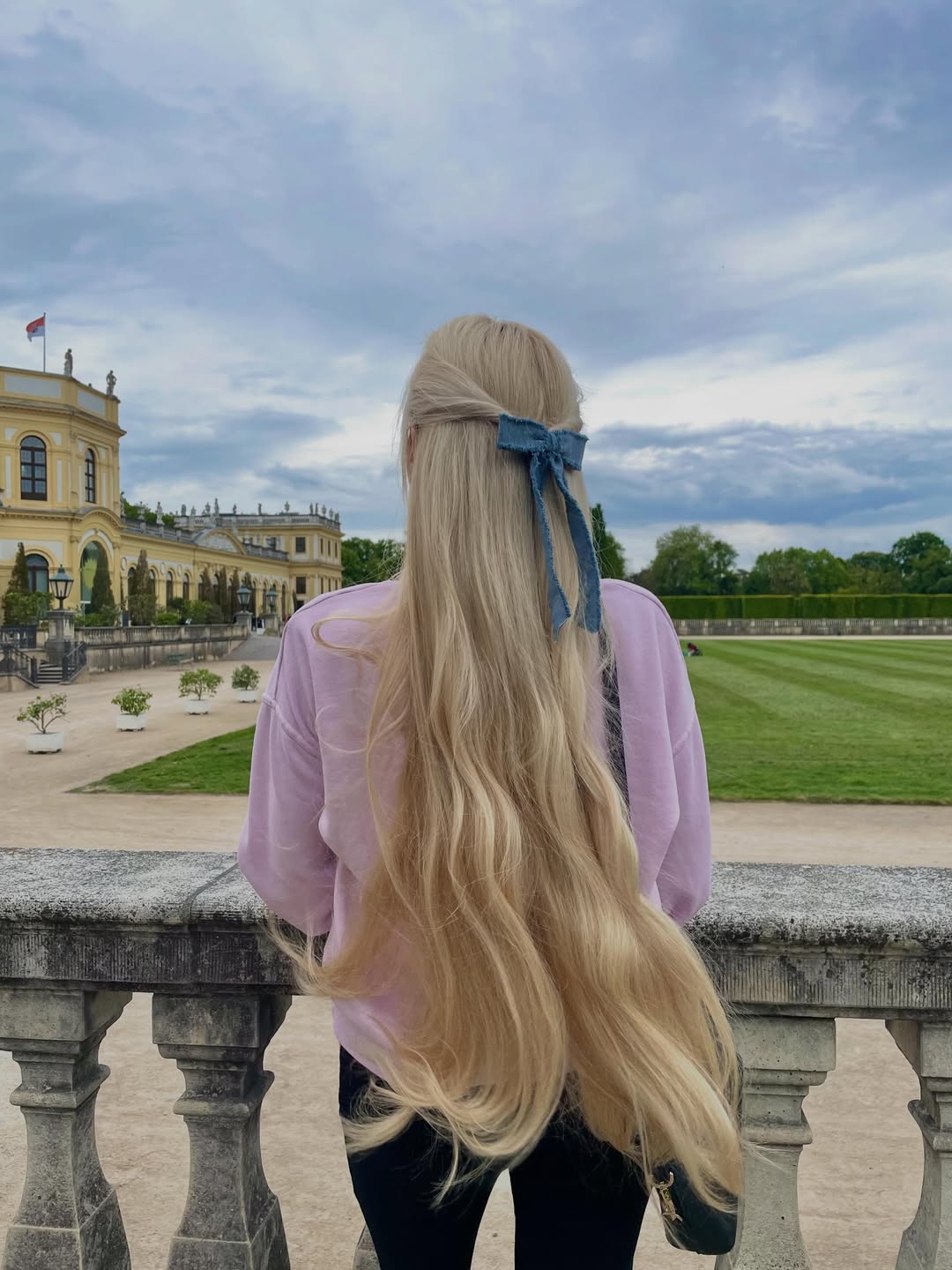 Rapunzel Length Blonde Hair With Half Updo Bow
