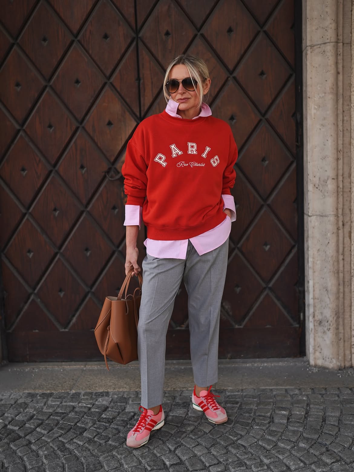 Red Graphic Sweatshirt With Pink Shirt And Grey Trousers