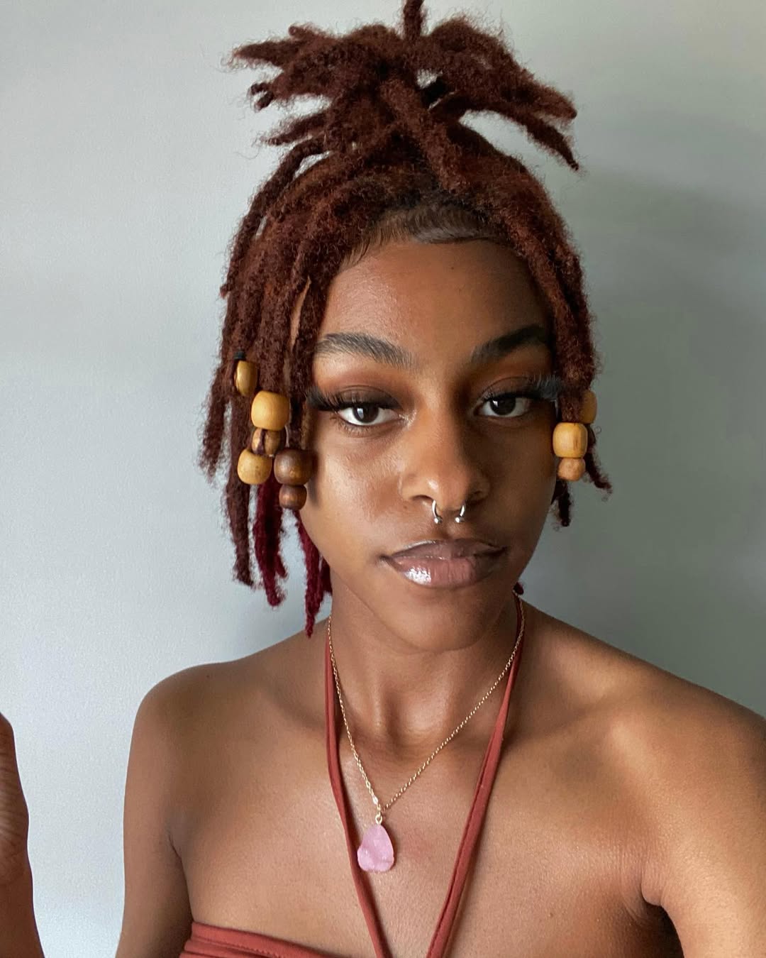Red Locs Updo With Wooden Beads