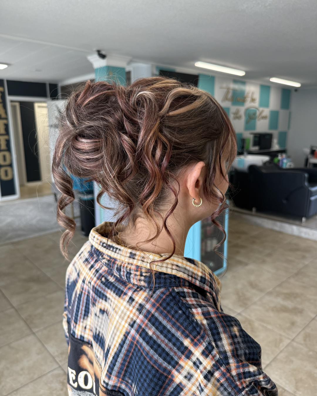 Relaxed Curly Updo With Face-Framing Tendrils And Highlights
