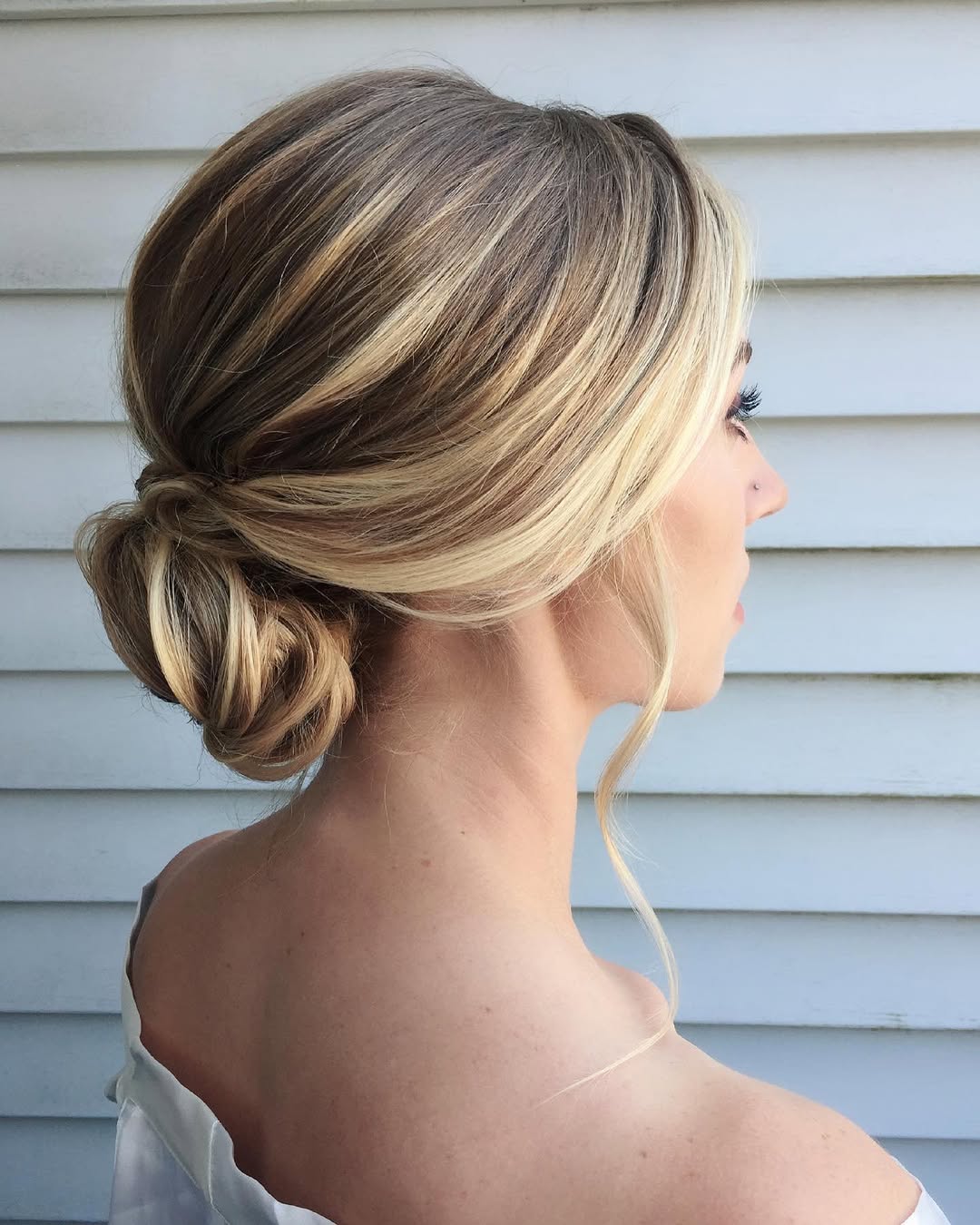 Relaxed Glam Low Bun With Face-Framing Strands