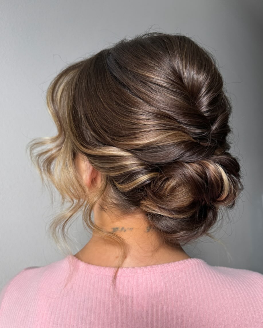 Relaxed Glamour Low Bun With Face-Framing Waves