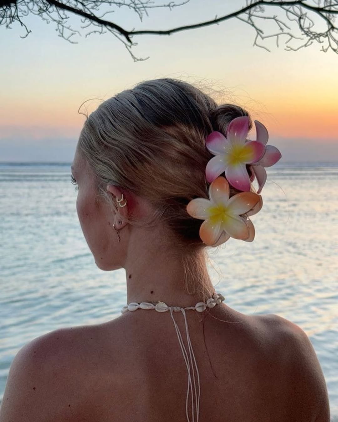 Relaxed Low Bun With Tropical Floral Accessories