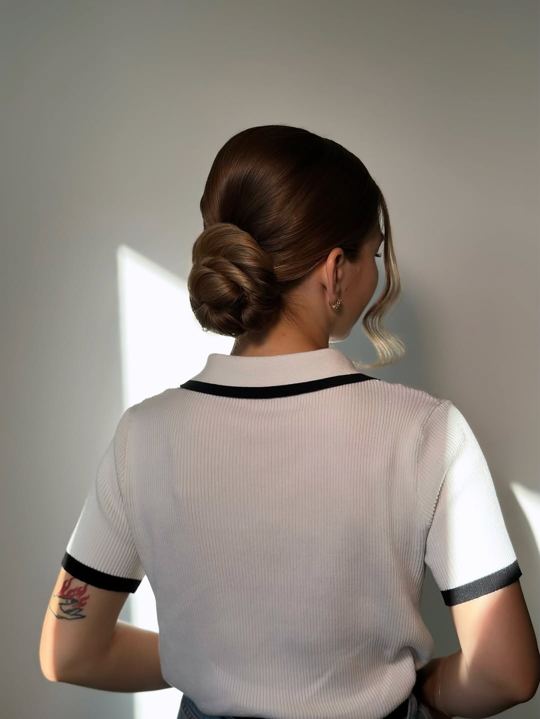 Relaxed Low Bun With Wispy Face Frames