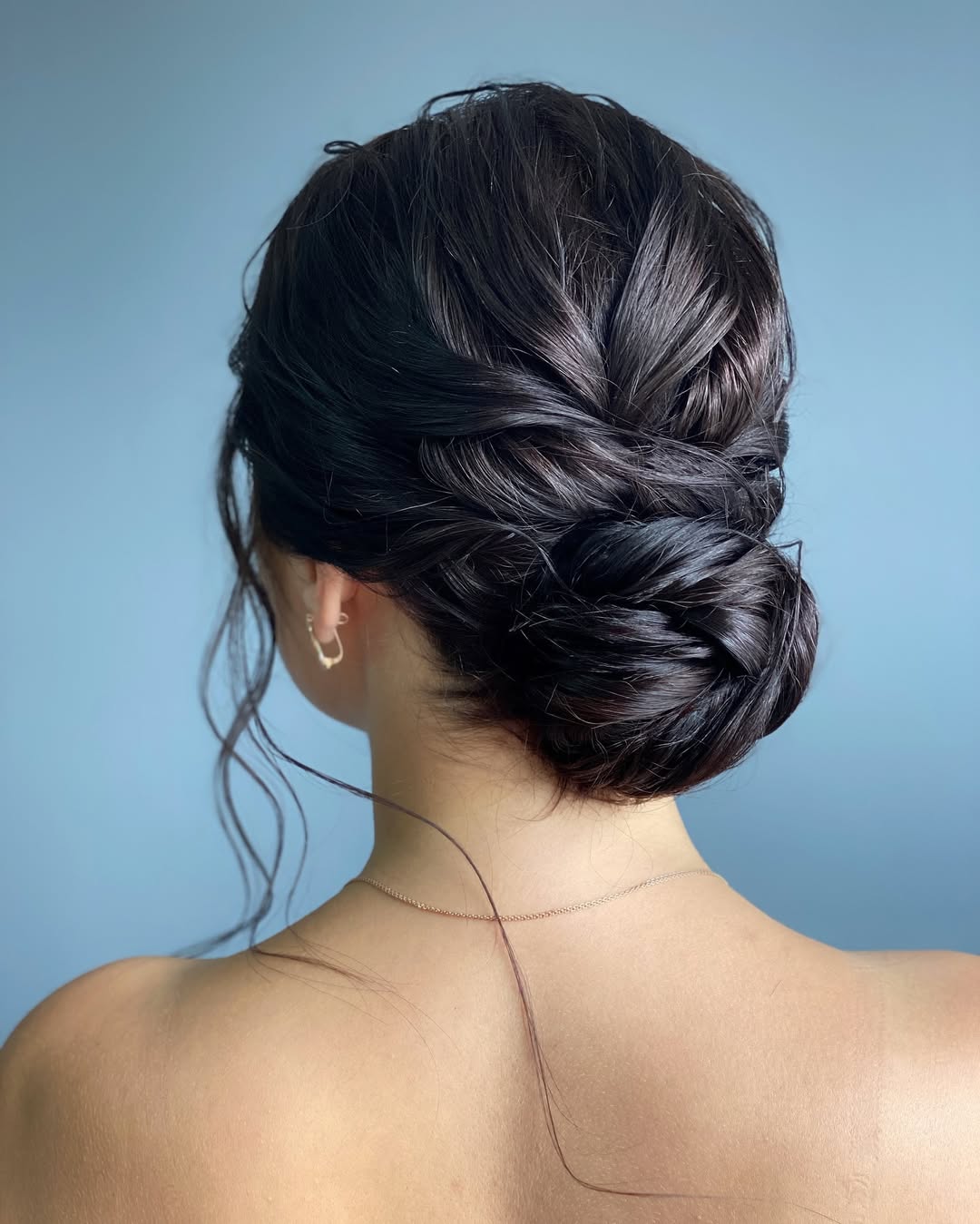 Relaxed Low Bun With Wispy Face-Framing Tendrils
