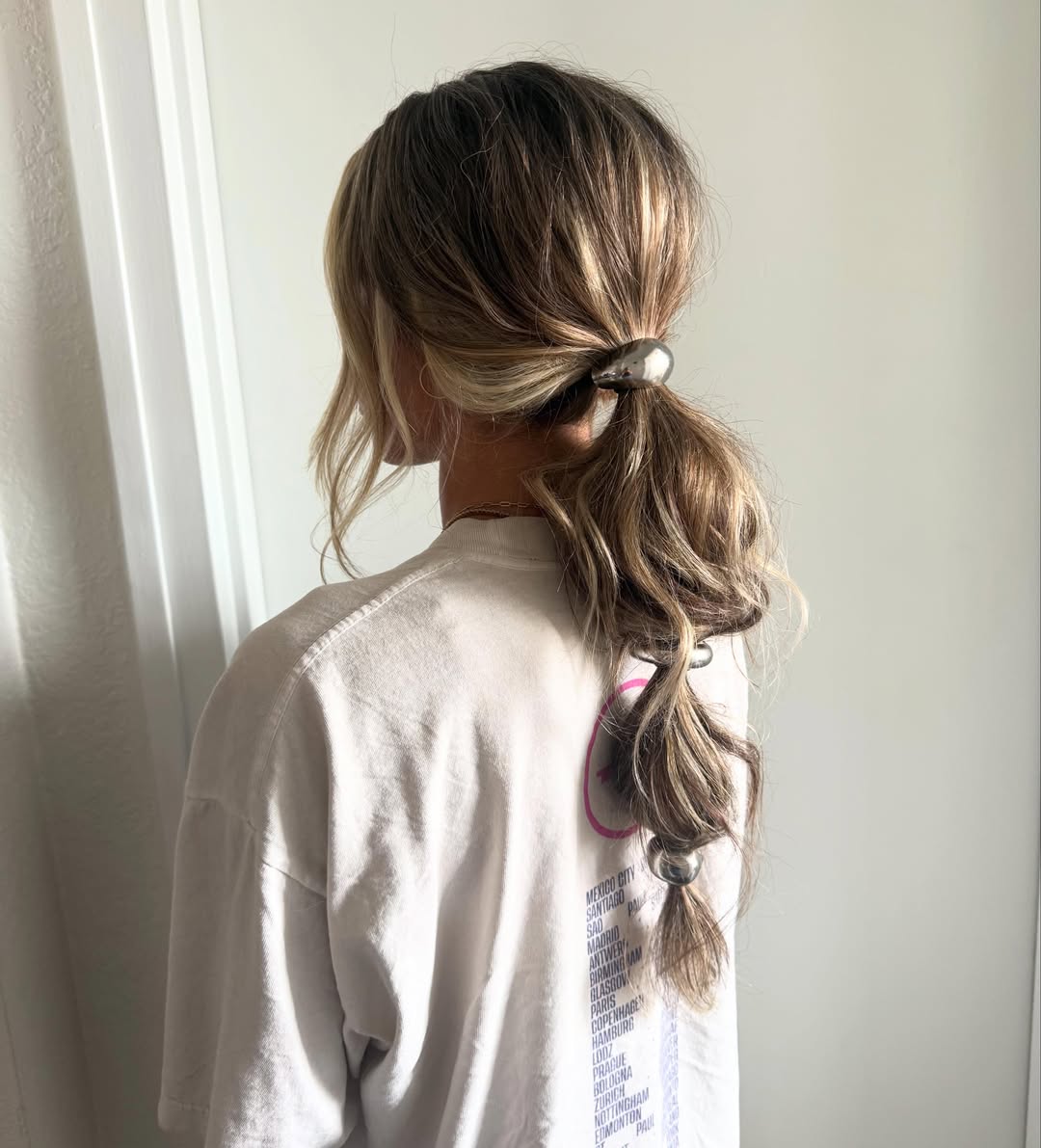 Relaxed Ponytail with Statement Metallic Hair Accessories