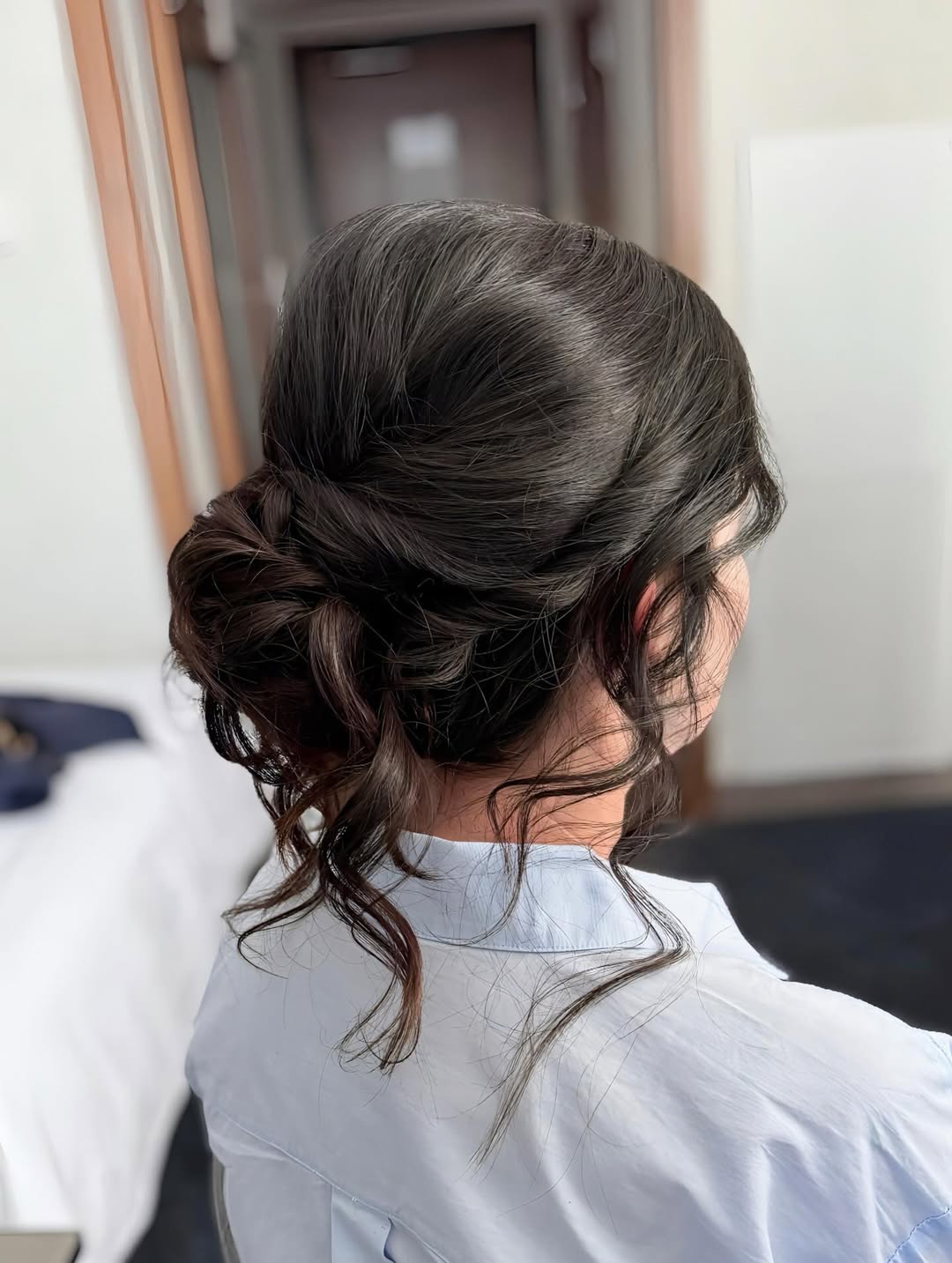 Relaxed Romantic Low Bun With Loose Tendrils