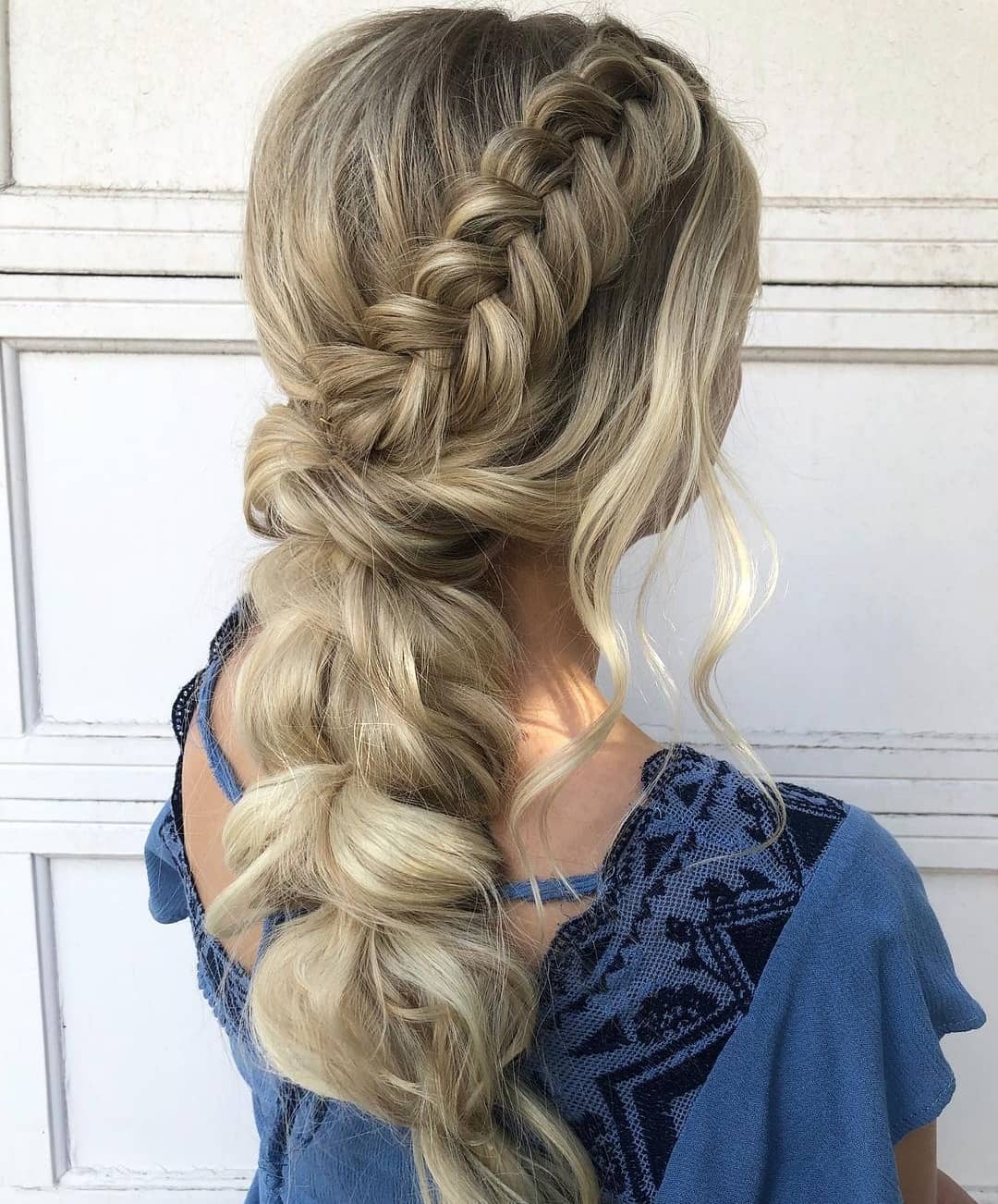 Relaxed Side Braid with Tousled Blonde Waves