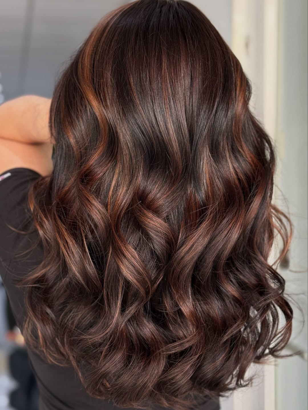 Rich Auburn Balayage On Dark Wavy Hair