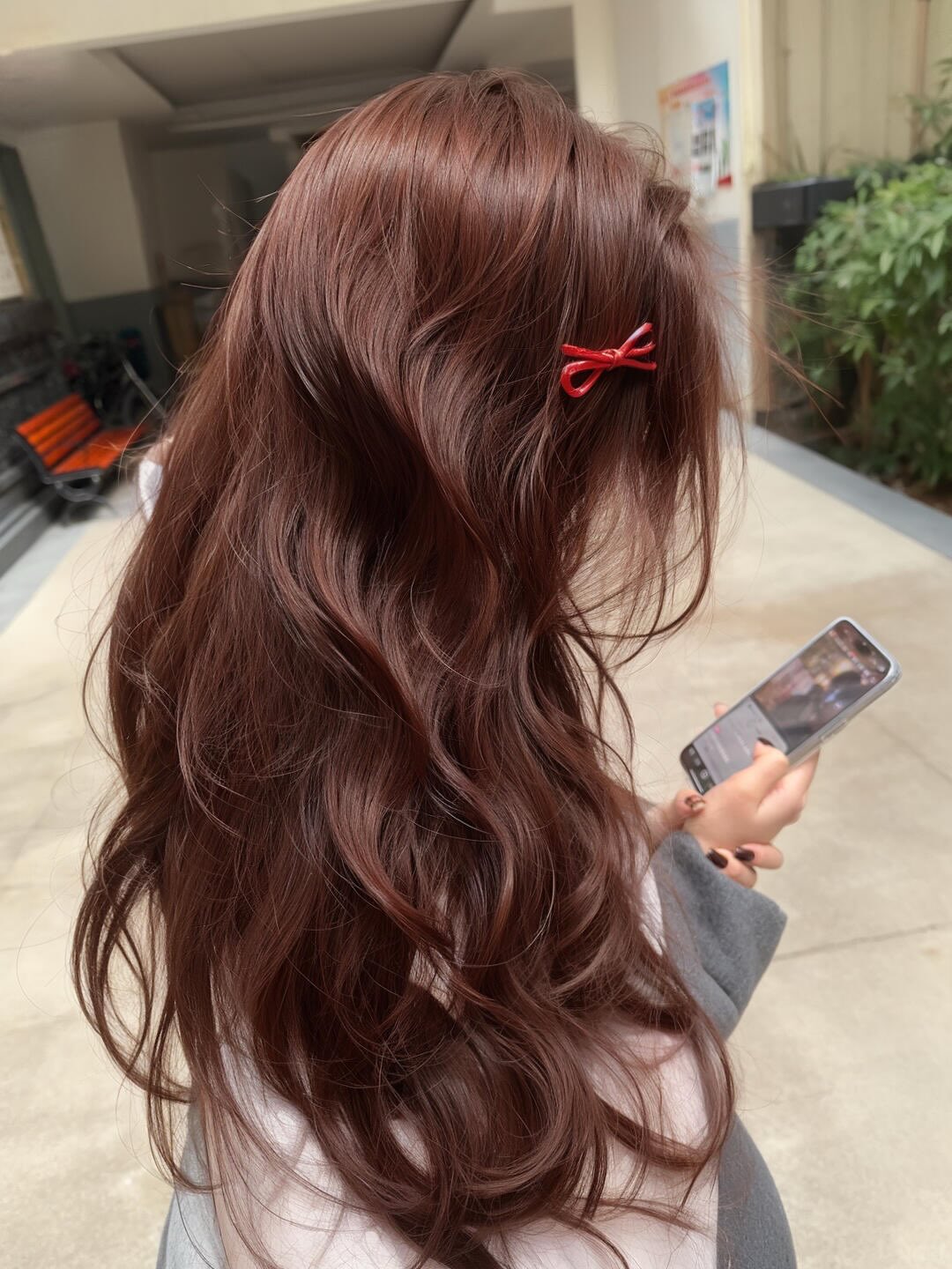Rich Auburn Waves With Cute Red Bow Clip