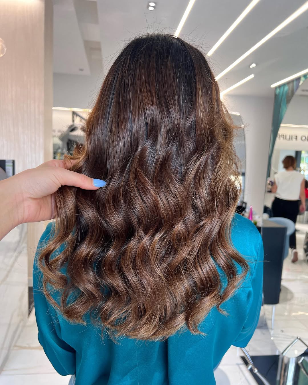Rich Brunette Balayage With Polished Hollywood Waves
